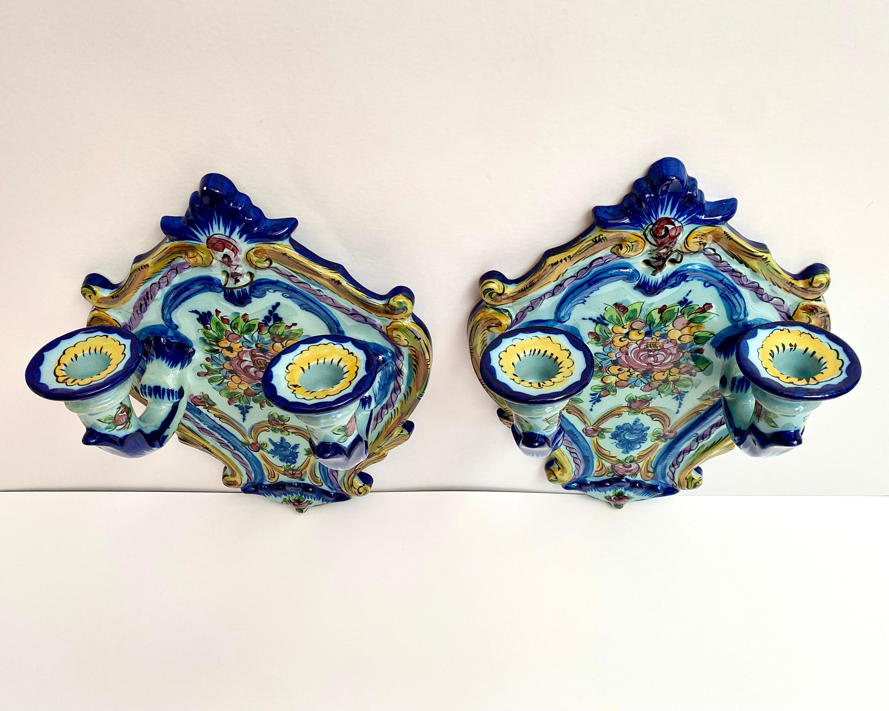 Beautiful and elegant set of 2 wall faience candlesticks for 2 candles, Portugal, 1960s. 

The candelabra will become the highlight of your interior; they will add an atmosphere of romance and mystery.

Luxurious candlesticks amaze with their