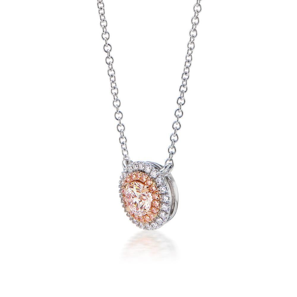 FAINT PINK DIAMOND PENDANT
This gorgeous GIA certified 0.40 ct Faint Pink Diamond is delicately
placed in a prong setting surrounded by a halo of bright white and pink diamonds
Item: # 04124
Metal: 18k W / P
Lab: Gia
Diamond Weight: 0.53 ct. 