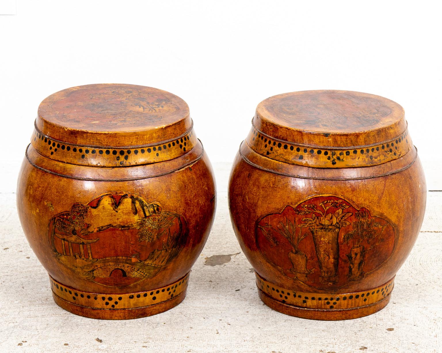 Pair of wooden rice barrels with lids featuring lacquer work with ink and paint on gold leaf depicting scenes in cartouches all on a red ochre colored painted ground. Pastoral scenes and various breeds of birds are featured as well as geometric