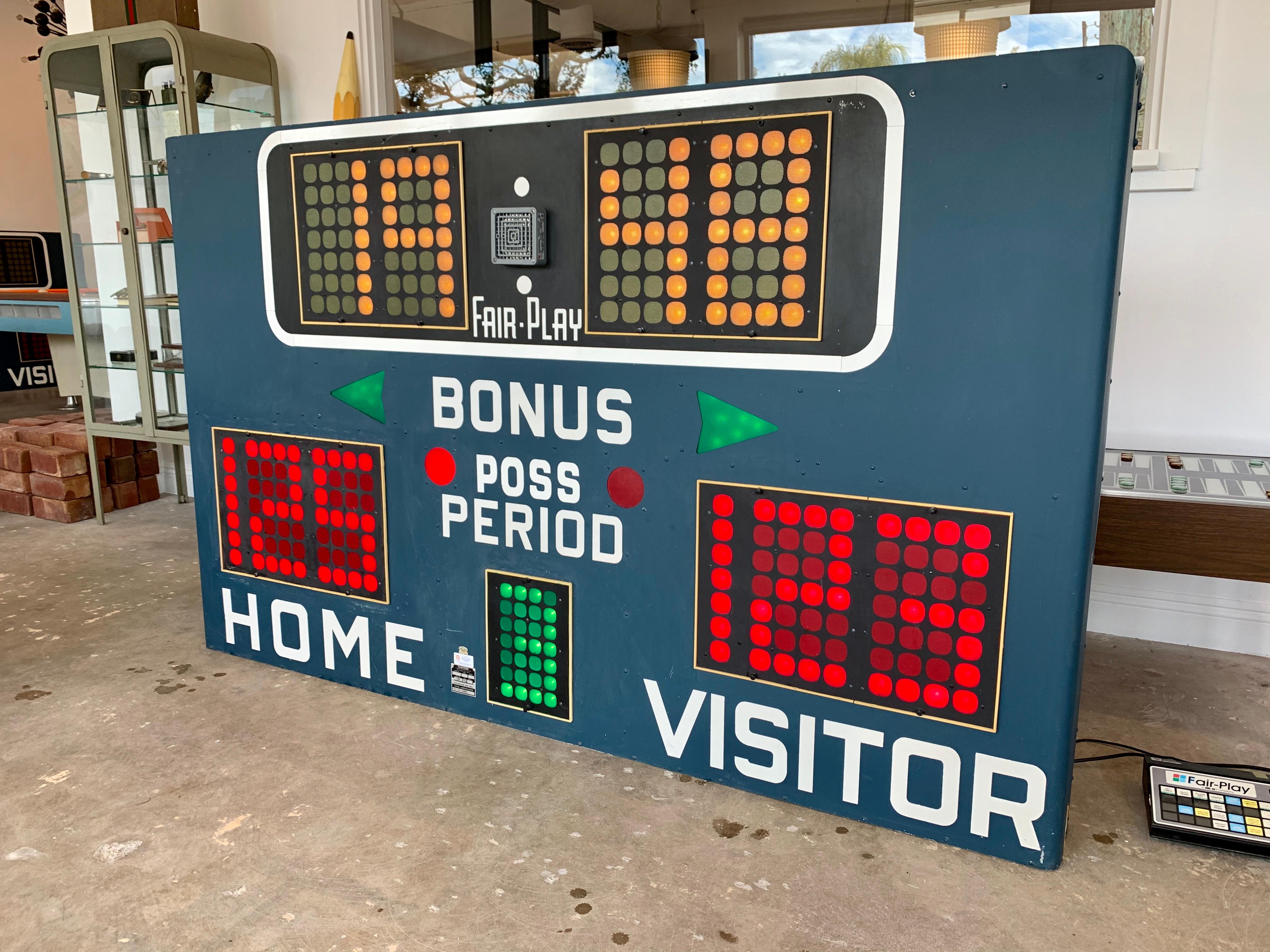 Two great matching vintage basketball scoreboards by Fair Play, made in the 1970s. In perfect working order with controller to adjust score, running shot clock etc. and working horn. Very fun piece of art for your home or commercial space. Taken