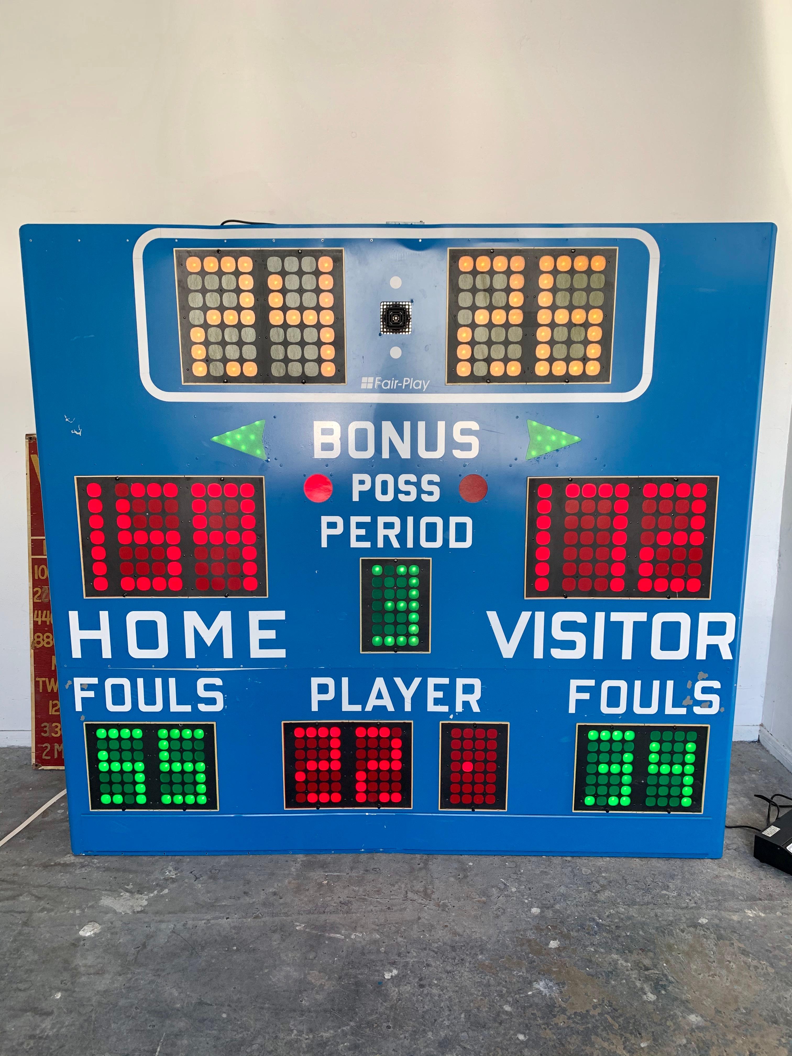Vintage basketball scoreboards by Fair Play, made in the 1970s. In working order with controller to adjust score, running shot clock etc. and working horn. Very fun piece of art for your home or commercial space. Taken down from a school gymnasium.