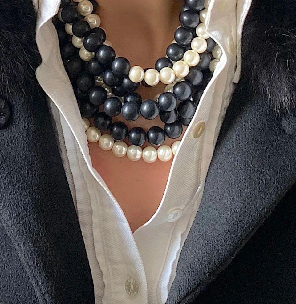 Simply Beautiful! Fairchild Baldwin 12mm Matte Black resin and Pearl glass Beads Lightweight Multi Strand Necklace. 
Black Leather collar
Adjustable magnetic closure
Great for Travel
Hand crafted in Italy 
Comes with a leather extender and your own