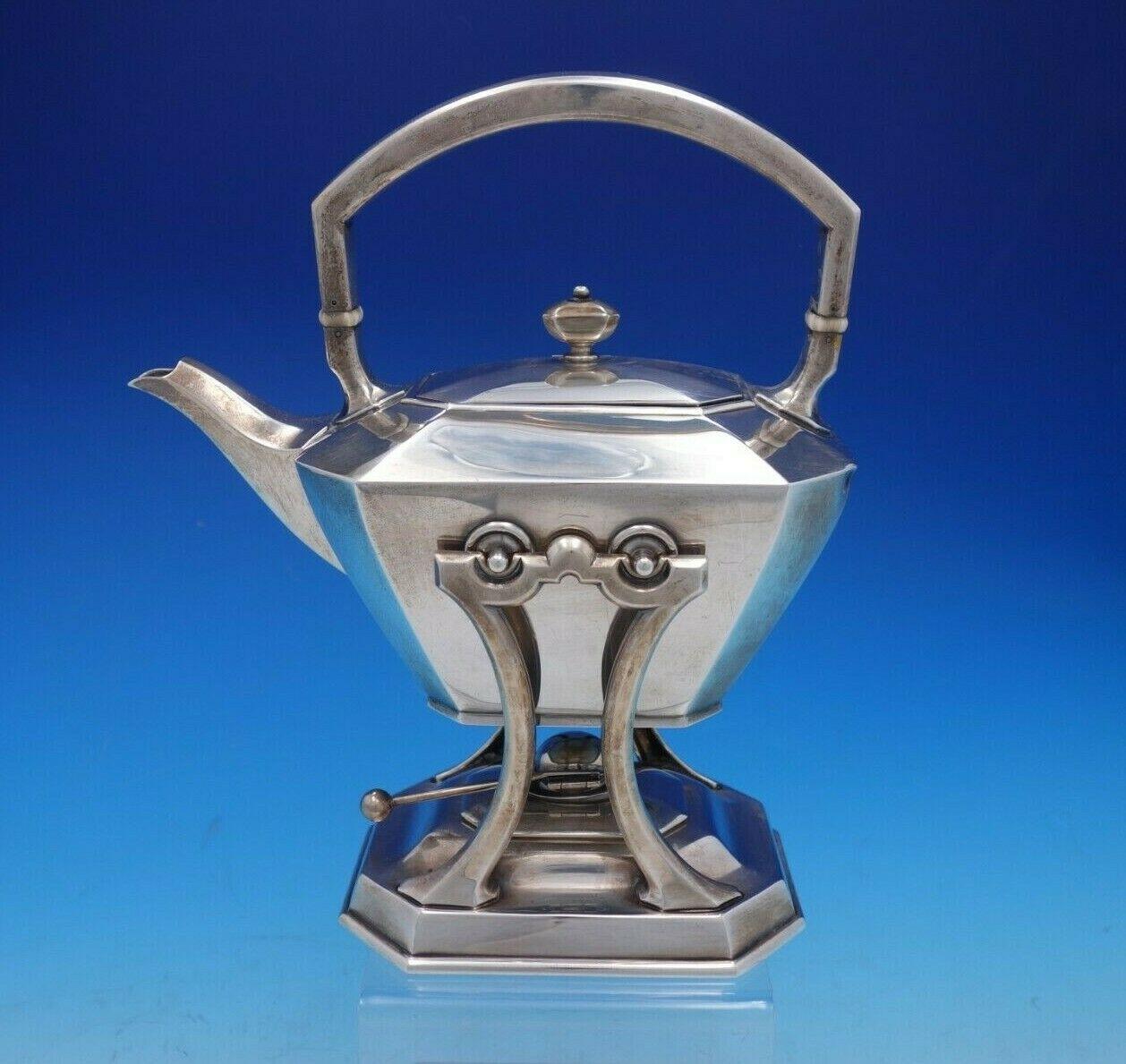 Fairfax by Durgin-Gorham

Exceptional Fairfax by Durgin-Gorham sterling silver 5-piece tea set marked #4. This set includes:

1 - Kettle on stand: Holds 2 pints, measures 10 3/4