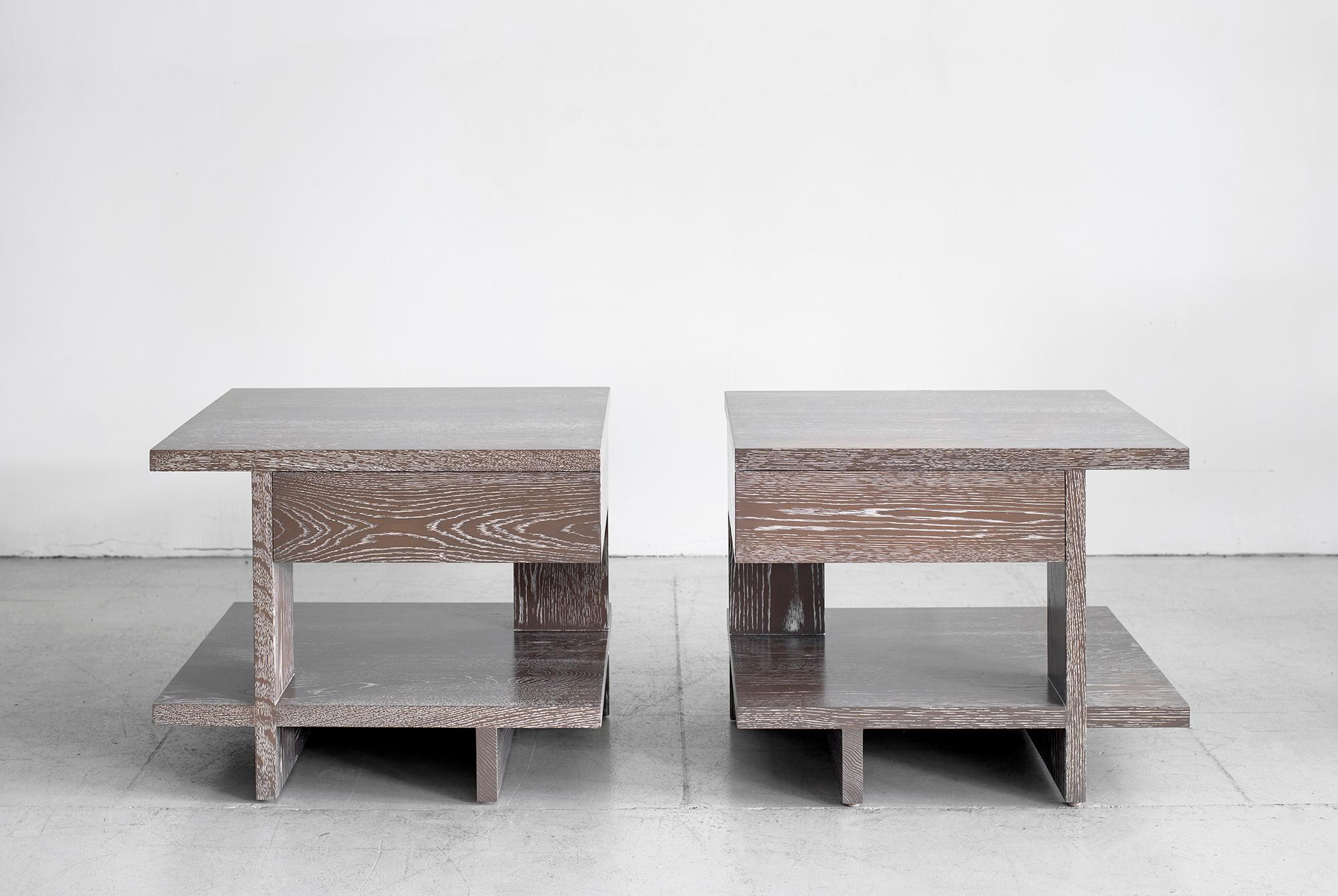 Pair of end tables with geometric shaped design and pullout / pull-out drawer. Great from all angles. Newly produced in oak with a grey Cerused oak finish.