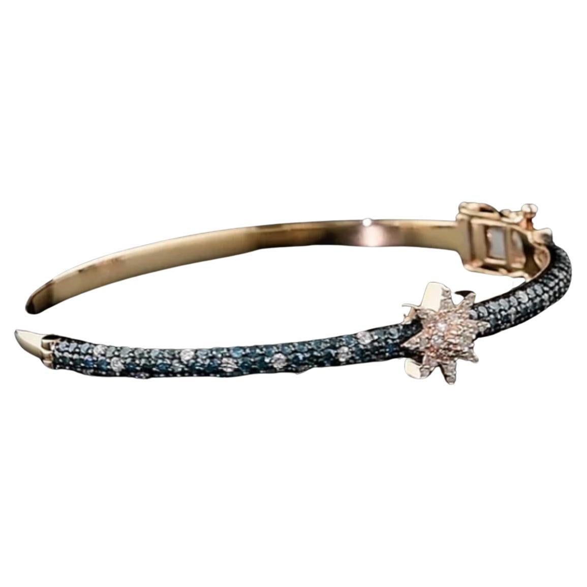 Venus Blue Diamond Gold Bangle
Crafted from 14k Rose Gold and embellished with a 0.45 Ct G-VS-SI Diamond and a 1.12 Ct Blue Diamond, this exquisite talisman measures 6 cm in diameter, representing not only elegance and refinement but also the