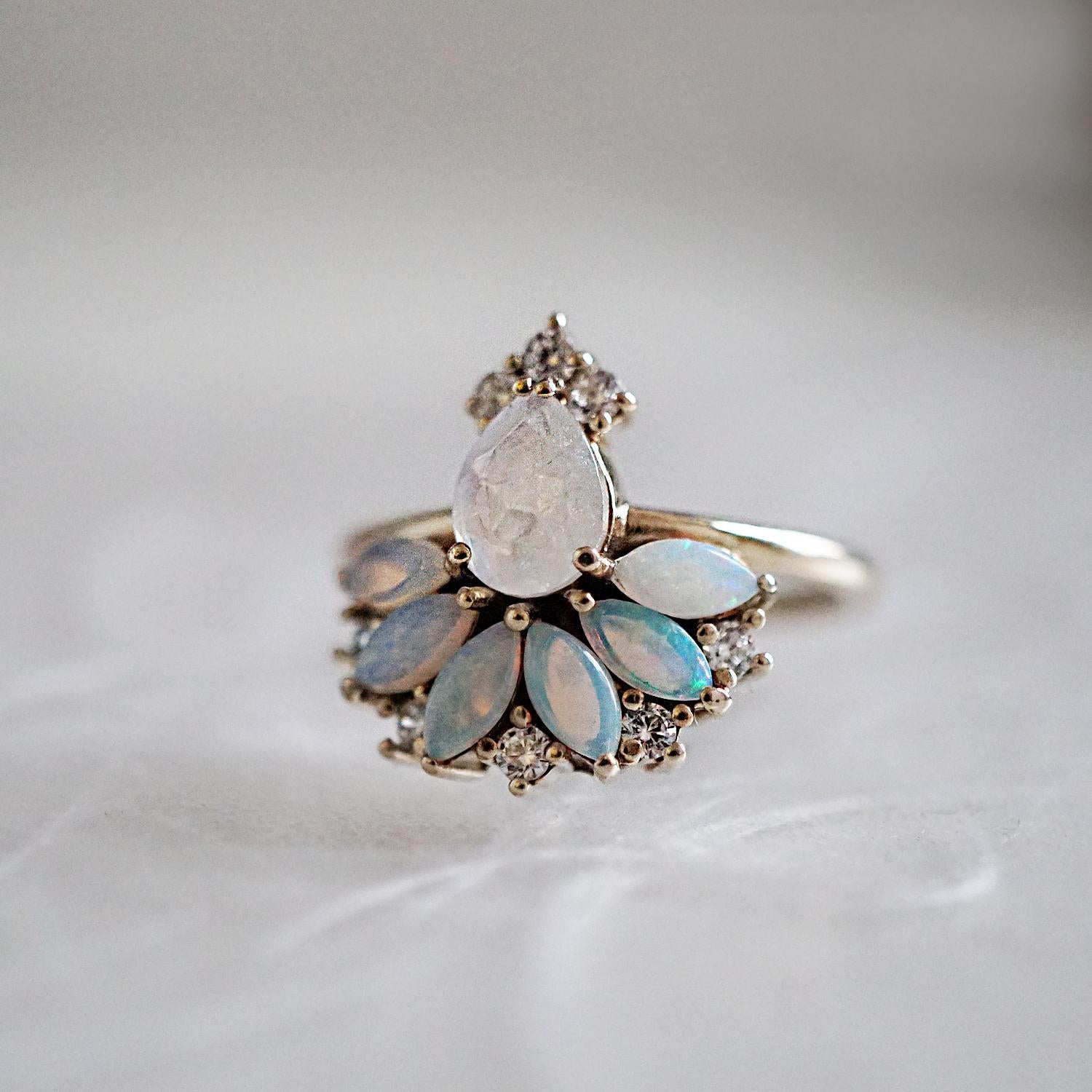 ** Tippy Taste Heirloom Collection are made to order. Please allow 3-4 week turnaround time. Make a note of your ring size and metal color during checkout. 

Blue pixie dust with a touch of moonlight. A fairytale inspired ring featuring 6 beautiful