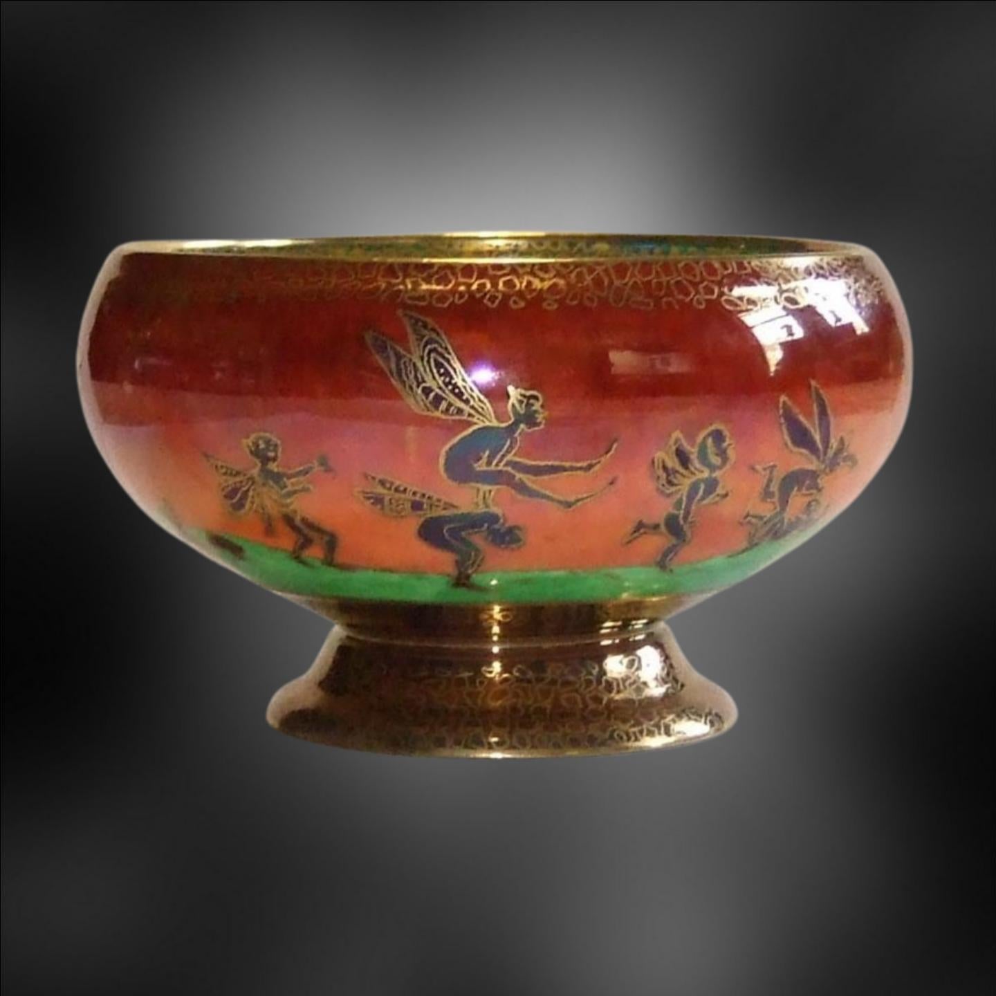 Footed bowl in the rare and attractive flame lustre, and a scarce shape; decorated with Leap-frogging Elves on the outside, and Elves on a Branch on the inside.

Wedgwood's Fairyland Lustre is a type of porcelain that was first produced by Wedgwood,