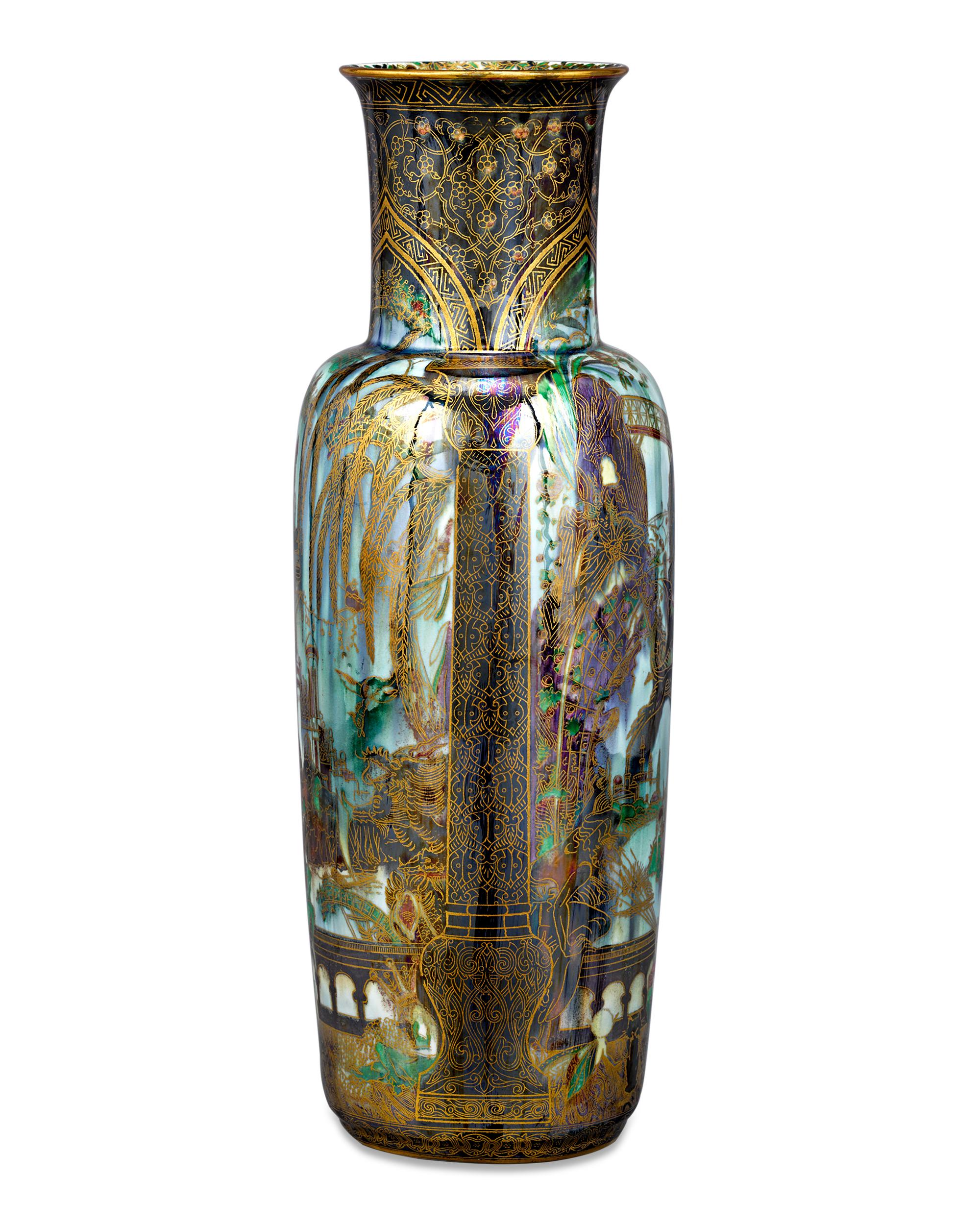 One of the earliest Fairyland Lustre motifs, this Pillar pattern vase by Wedgwood features the fantastical Isle of the Genii, populated with nymphs and elves at every turn. Introduced by Wedgwood artist Daisy Makeig-Jones in 1915, Fairyland Lustre