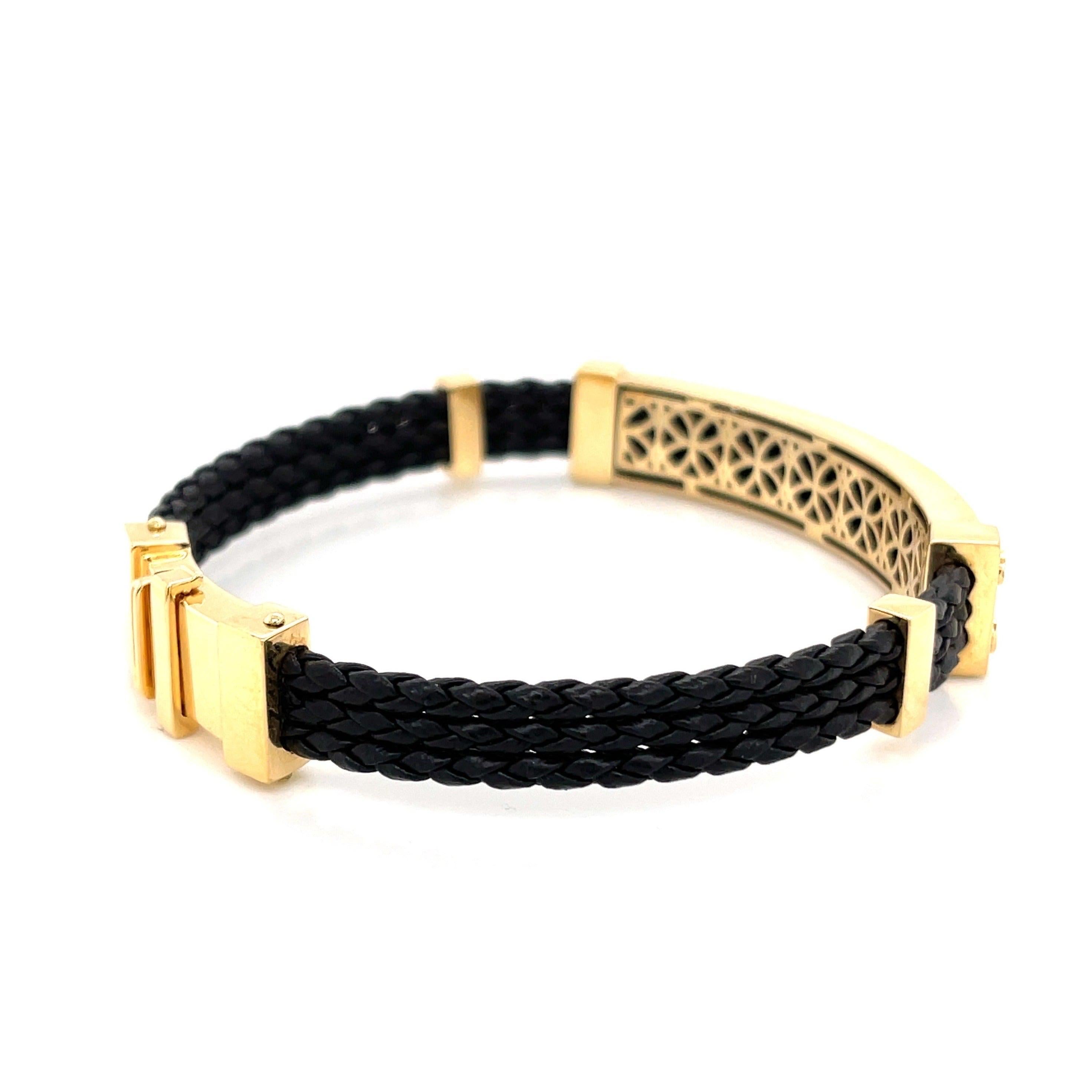 Make a bold statement with this sophisticated 18K yellow gold and leather bracelet, a perfect blend of luxury and modern edge. Handcrafted in Brazil, this fine jewelry piece features a striking combination of rich, braided black leather and polished