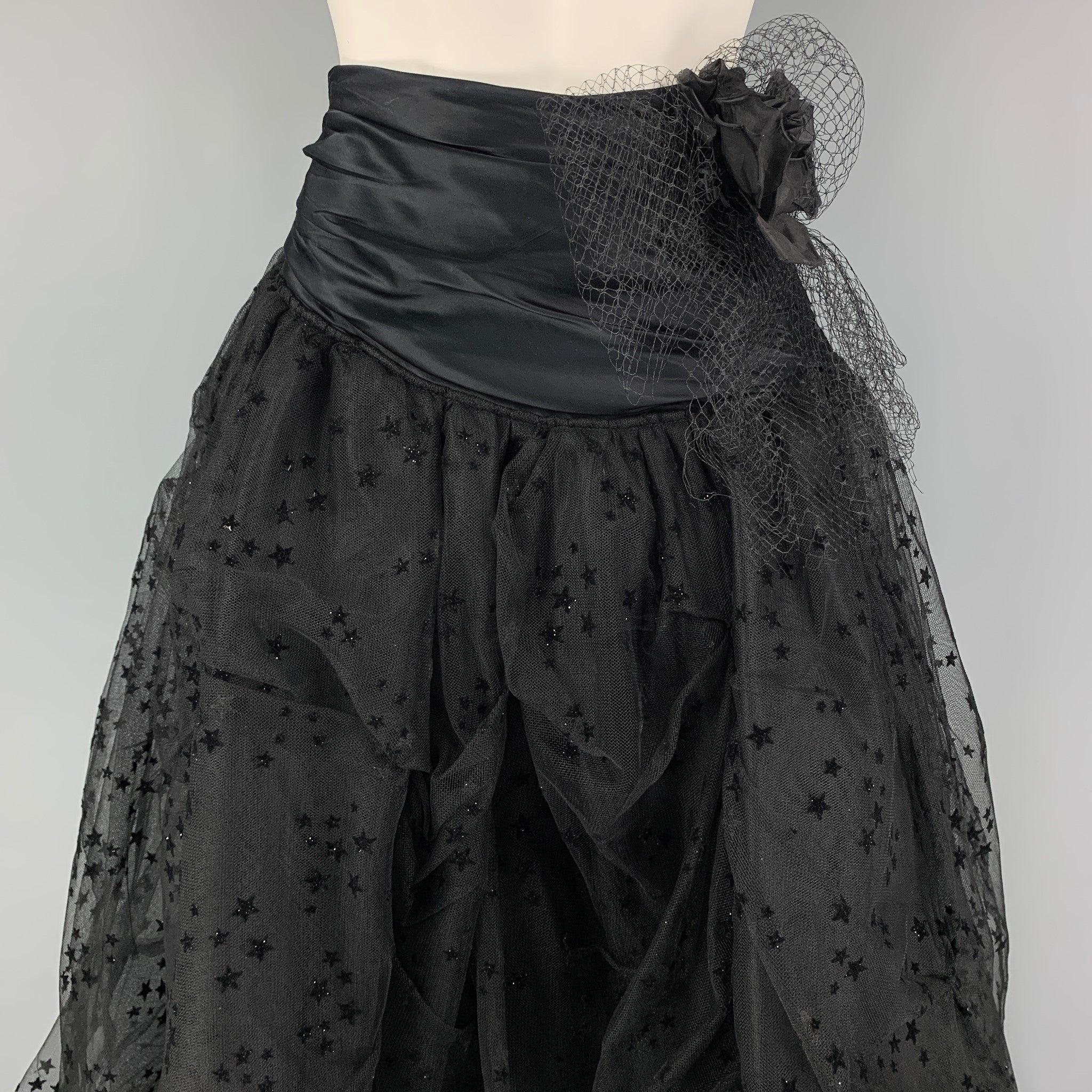 FAITH CONNEXION skirt comes in a black mixed fabrics with a mesh overlay featuring stat details, ruffled flower design, high waisted, and a side hook & loop closure.
Excellent
Pre-Owned Condition. 

Marked:   38 

Measurements: 
  Waist: 26 inches