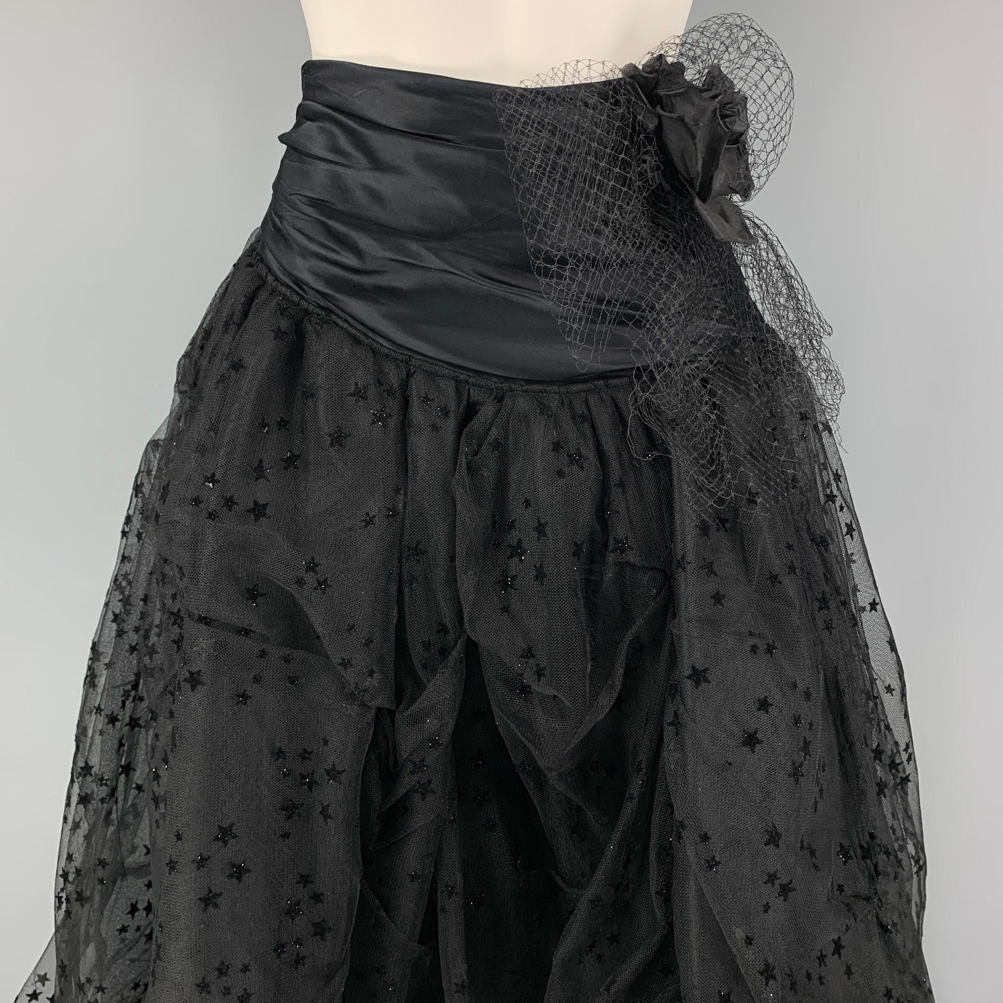 FAITH CONNEXION skirt comes in a black mixed fabrics with a mesh overlay featuring stat details, ruffled flower design, high waisted, and a side hook & loop closure. 

Excellent Pre-Owned Condition.
Marked: 38

Measurements:

Waist: 26 in.
Hip: 44