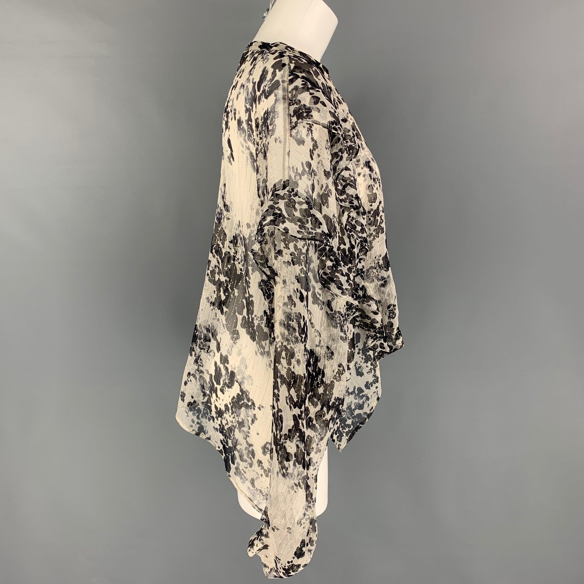 FAITH CONNEXION blouse comes in a black & white silk blend featuring a loose fit, metallic trim, ruffled, and a crew-neck.
Very Good
Pre-Owned Condition. 

Marked:   XS 

Measurements: 
 
Shoulder: 25 inches  Bust: 44 inches  Sleeve: 21 inches 