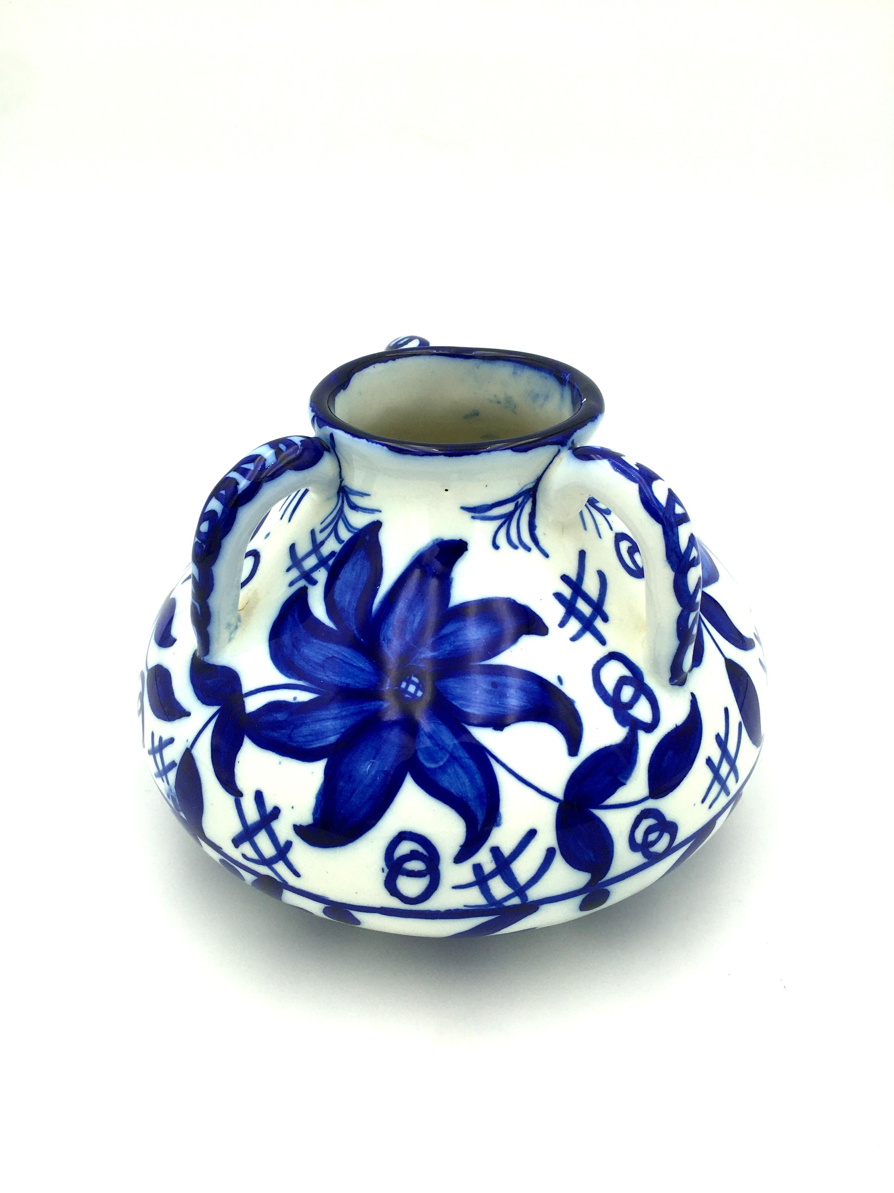 Lovely handmade jar of blue and white Granada Fajalauza ceramic with 3 handles decorated by hand with flowers and geometric motifs. Spain, Andalusia, Granada. Period: Early 20th century. Conditions: Very good. Wear consistent with age and use.