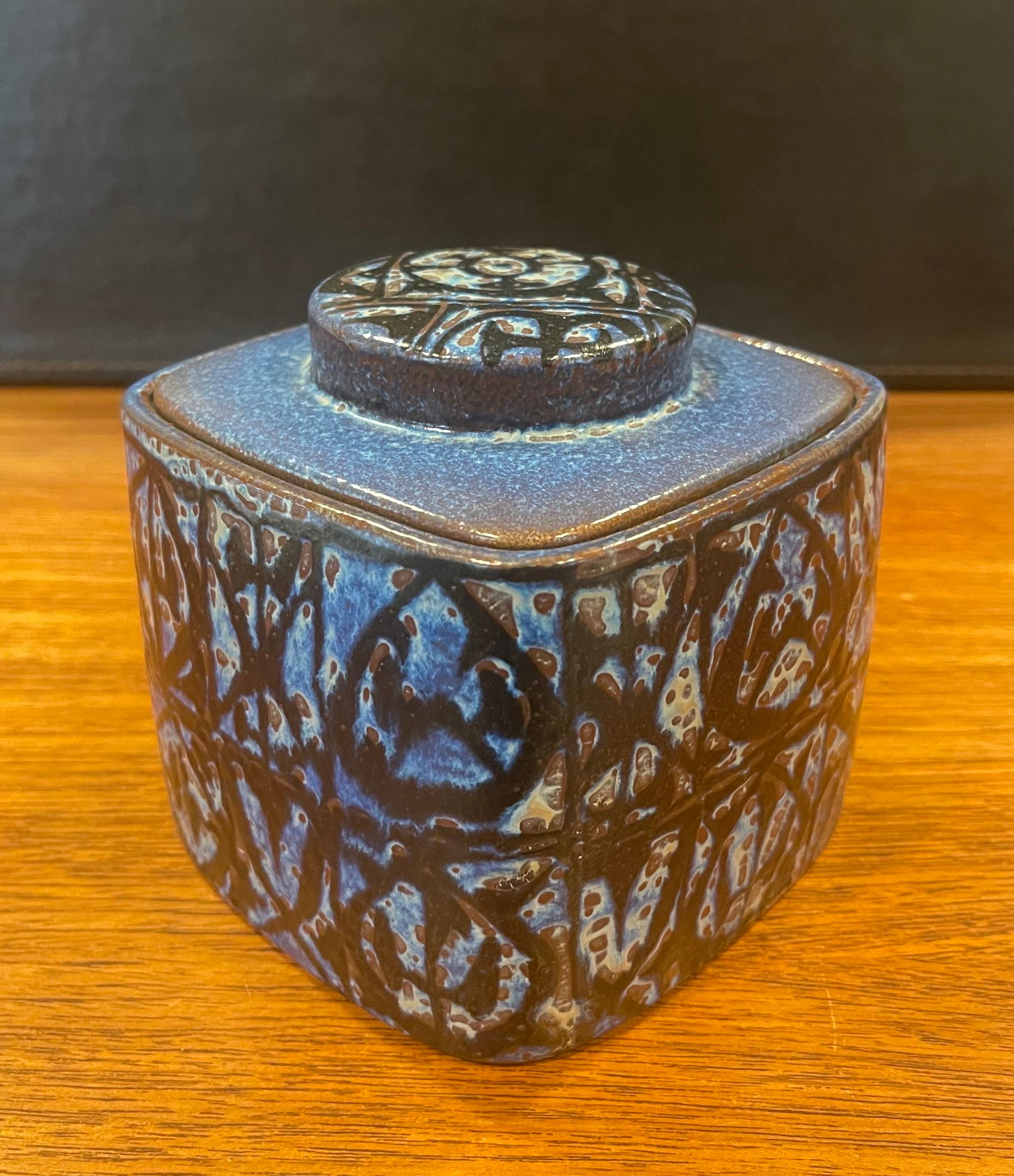 Wonderful Fajance lidded box / humidor from the Baca line by Nils Thorsson for Royal Copenhagen, circa 1960s. The stunning blue and black glazed stoneware container with geometric abstract design was designed by Royal Copenhagen's renowned artistic