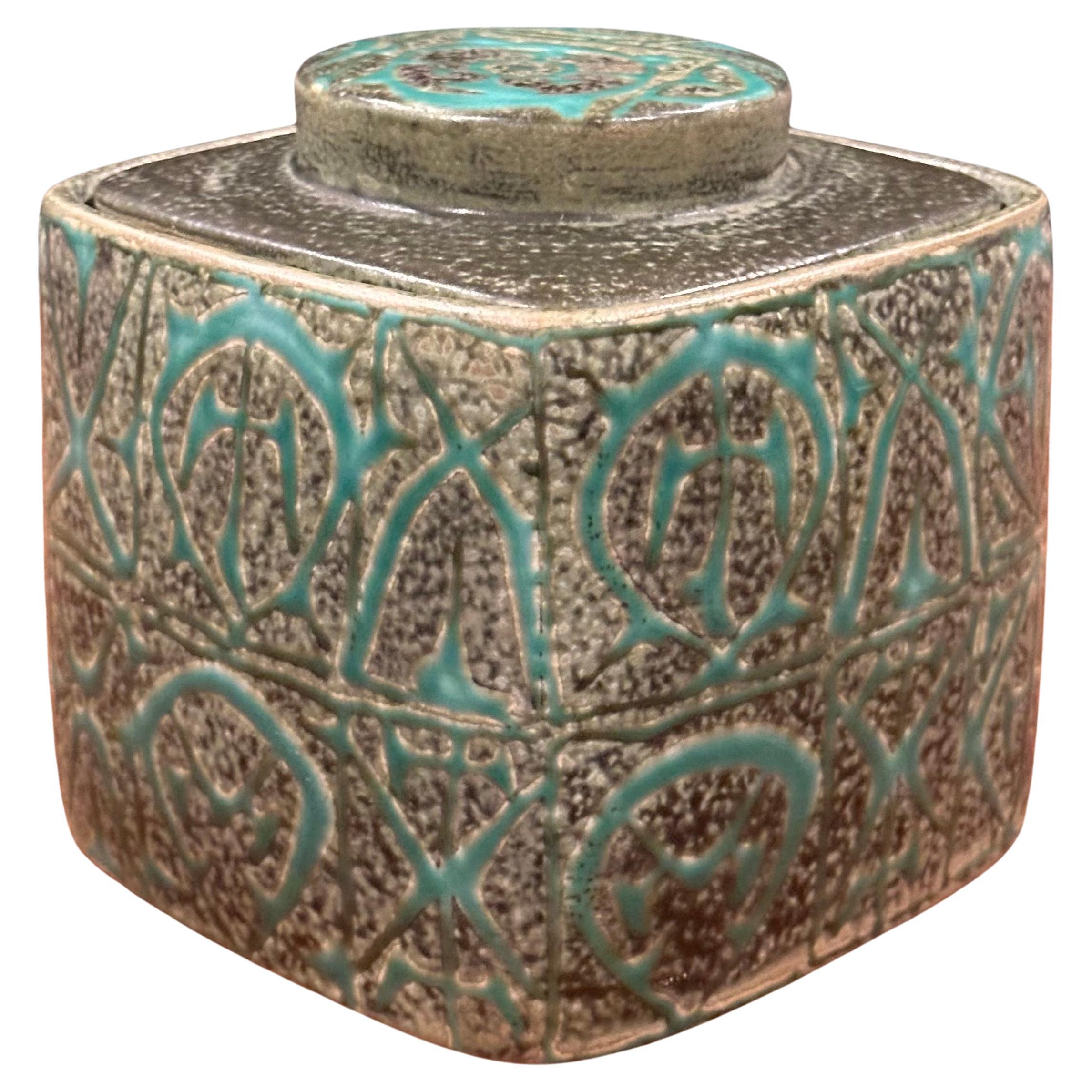 Wonderful Fajance lidded box / humidor from the Baca line by Nils Thorsson for Royal Copenhagen, circa 1960s. The stunning green and black glazed stoneware container with geometric abstract design was designed by Royal Copenhagen's renowned artistic
