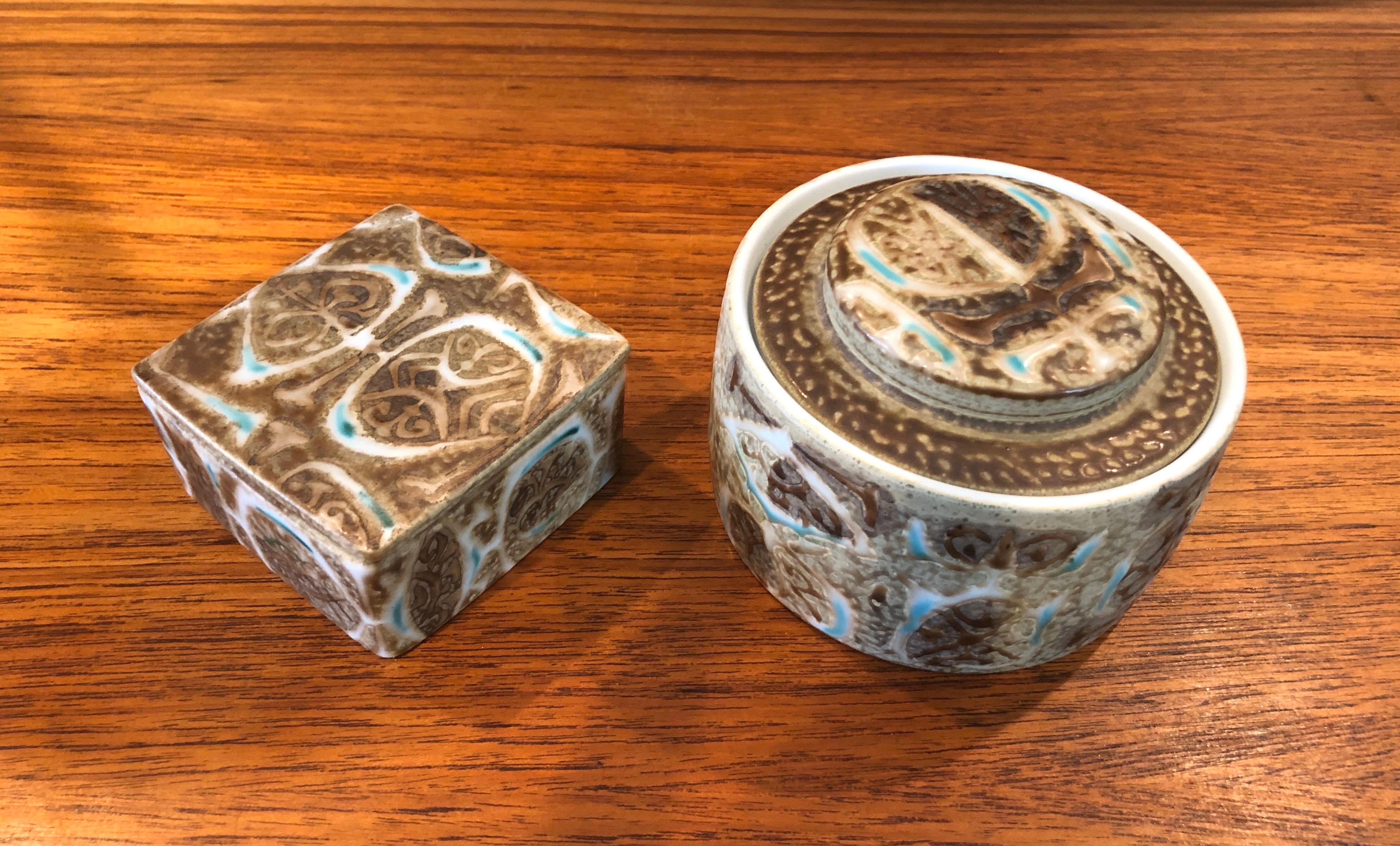 Wonderful Fajance lidded box and jar from the Baca line by Nils Thorsson for Royal Copenhagen, circa 1960s. The brown, tan and blue glazed stoneware containers with geometric abstract design was designed by Royal Copenhagen's renowned artistic
