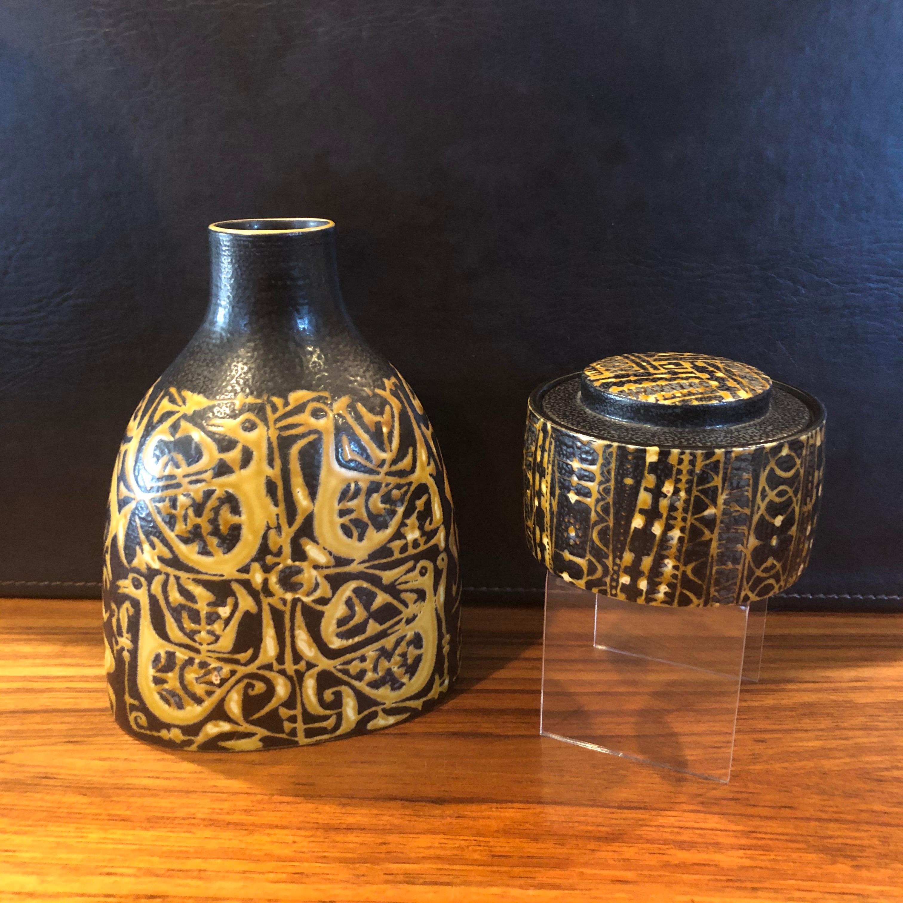 Wonderful Fajance lidded box and jar from the Baca line by Nils Thorsson for Royal Copenhagen, circa 1960s. The brown and yellow glazed stoneware containers with geometric abstract design was designed by Royal Copenhagen's renowned artistic