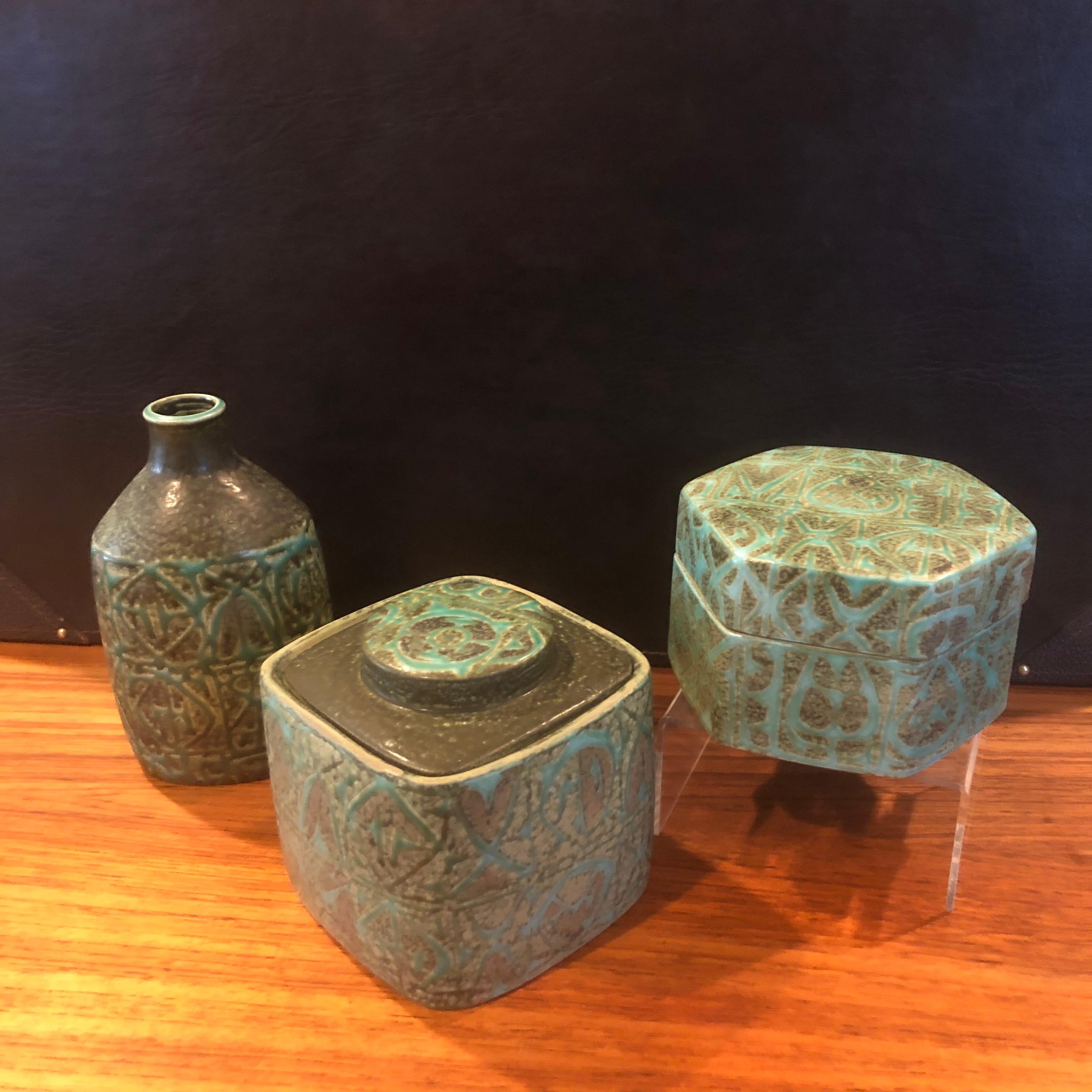 Wonderful Fajance three-piece vase, lidded hexagon box & humidor set from the Baca line by Nils Thorsson for Royal Copenhagen, circa 1960s. The green and grey glazed stoneware containers with geometric abstract design was designed by Royal