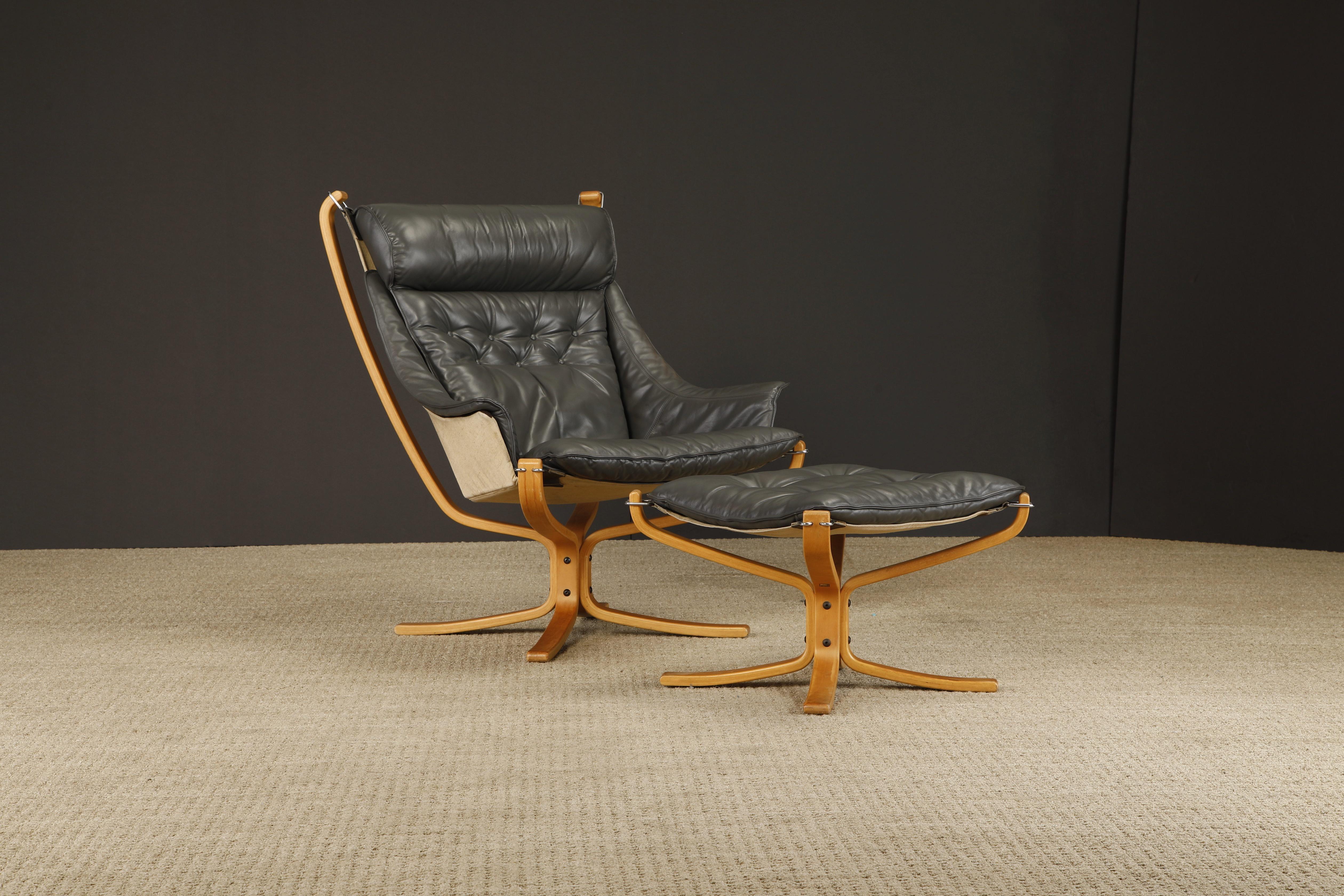 An iconic grey leather 'Falcon' sling chair and ottoman by Sigurd Ressell for Vatne Møbler, signed on both the chair frame and the ottoman. A more rare variation of the Falcon design, the lounge chair has both a highback with headrest and arms,