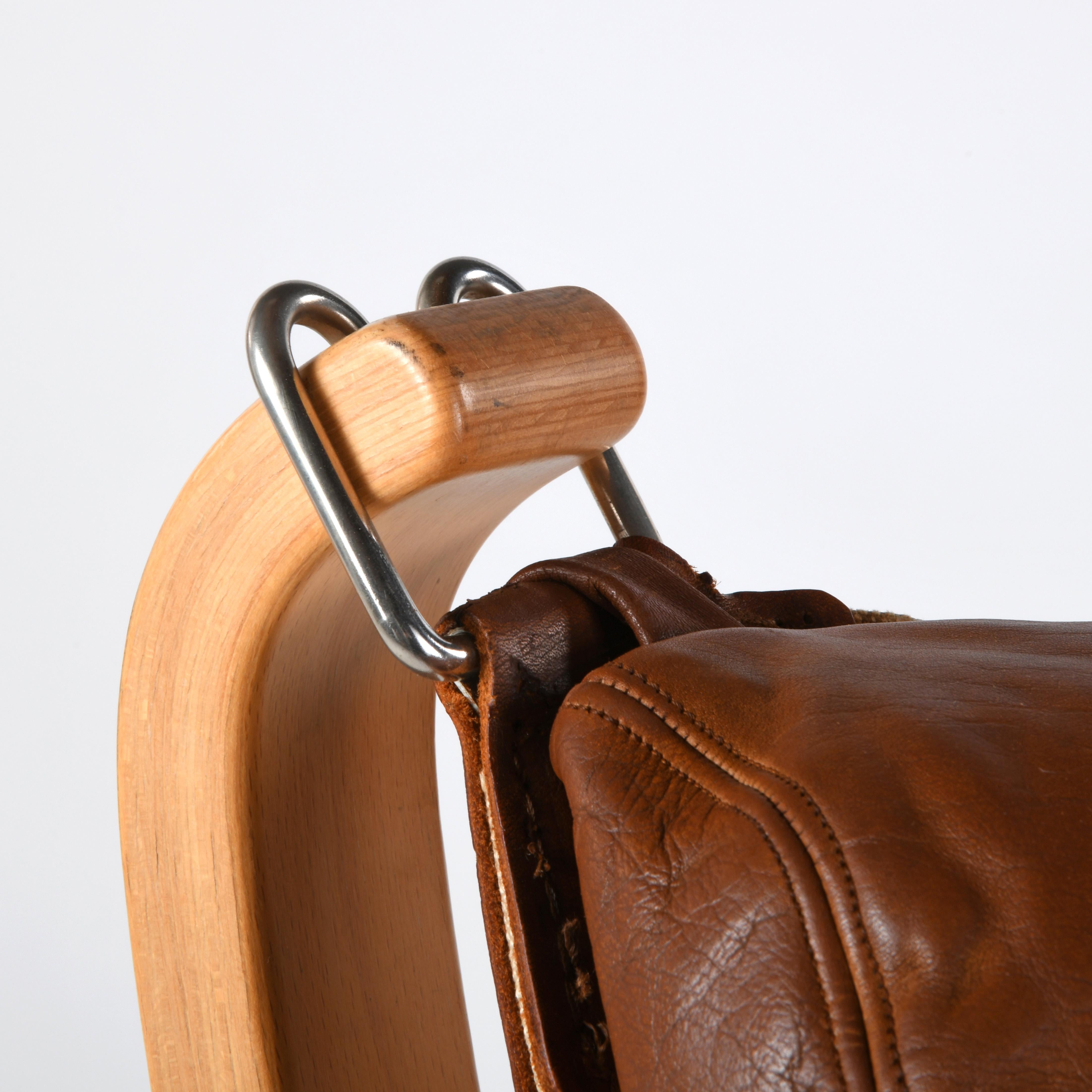 Falcon chair, design Sigurd Ressell, wood and brown leather version 2