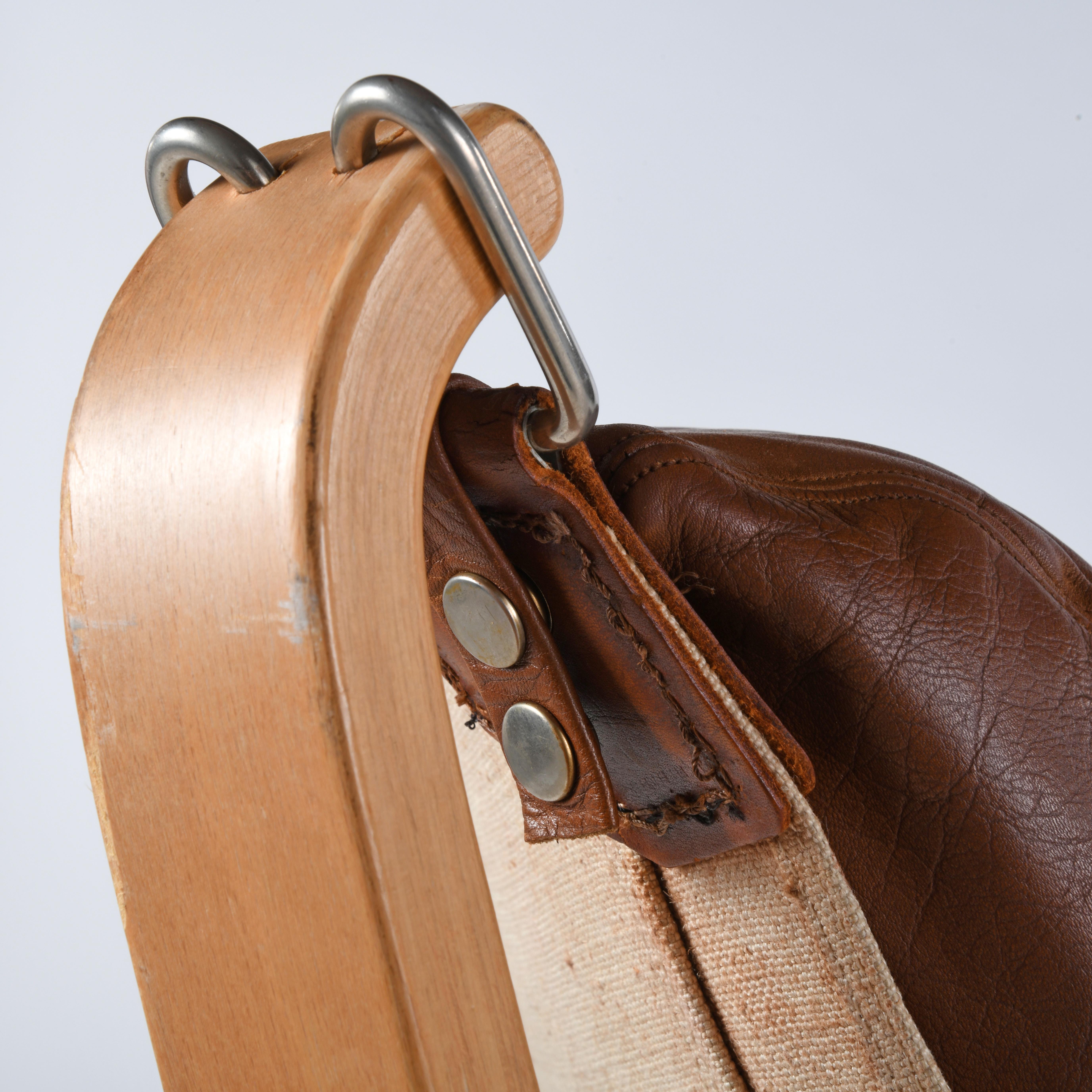 Falcon chair, design Sigurd Ressell, wood and brown leather version 5