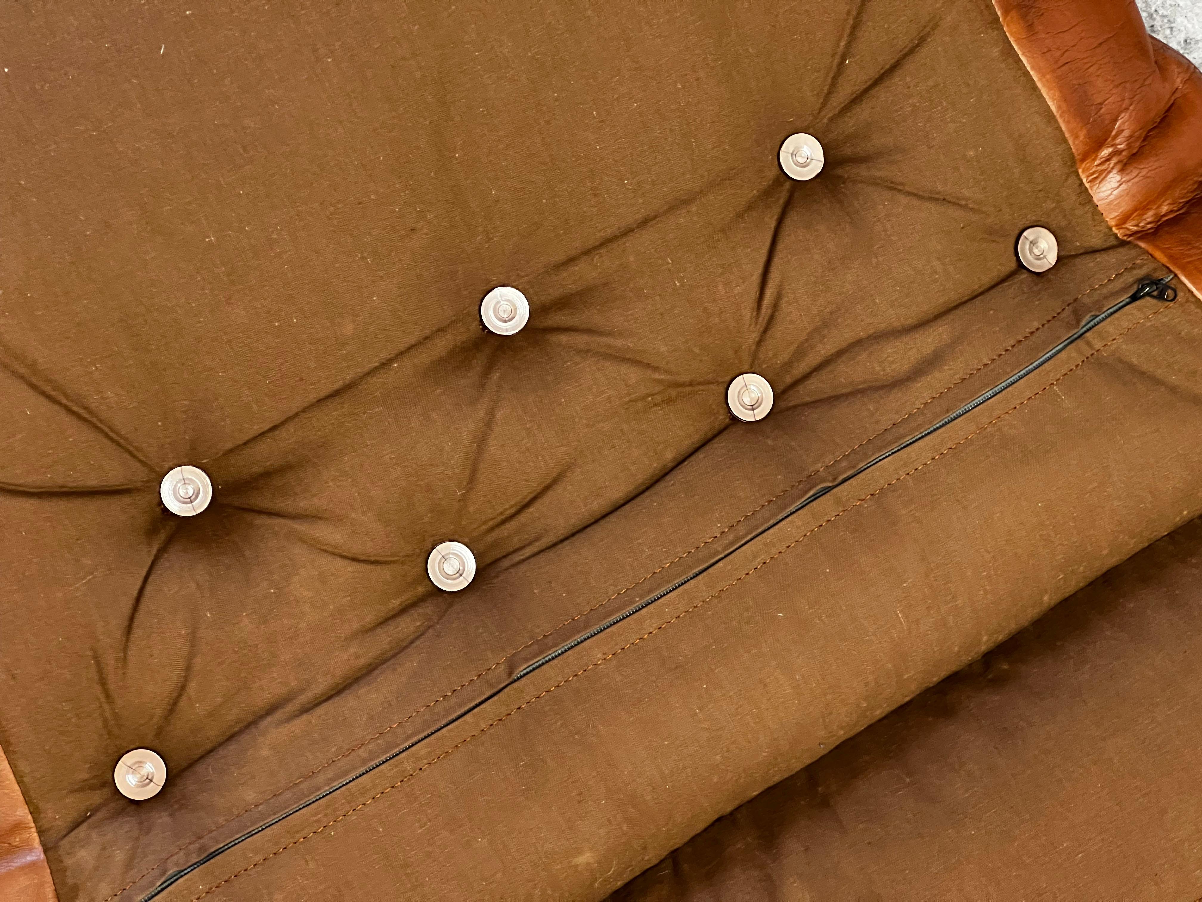Falcon chair, design Sigurd Ressell, wood and brown leather version 8