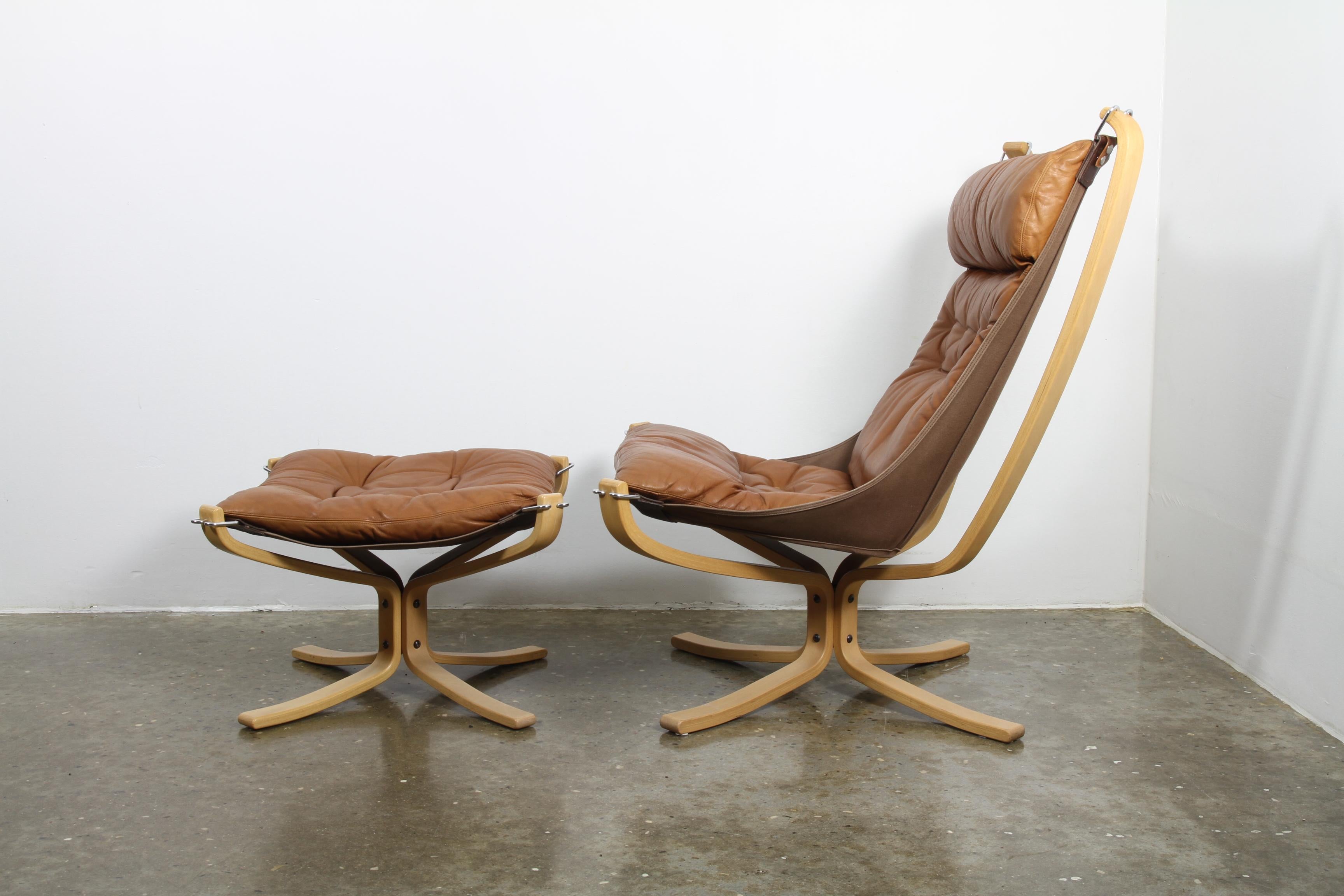 Scandinavian modern high back lounge chair with beech frame and leather cushions. Seat is suspended from the frame for great comfort. Beautiful and soft light brown leather. Very light use, extremely good vintage condition. Designed by Norwegian