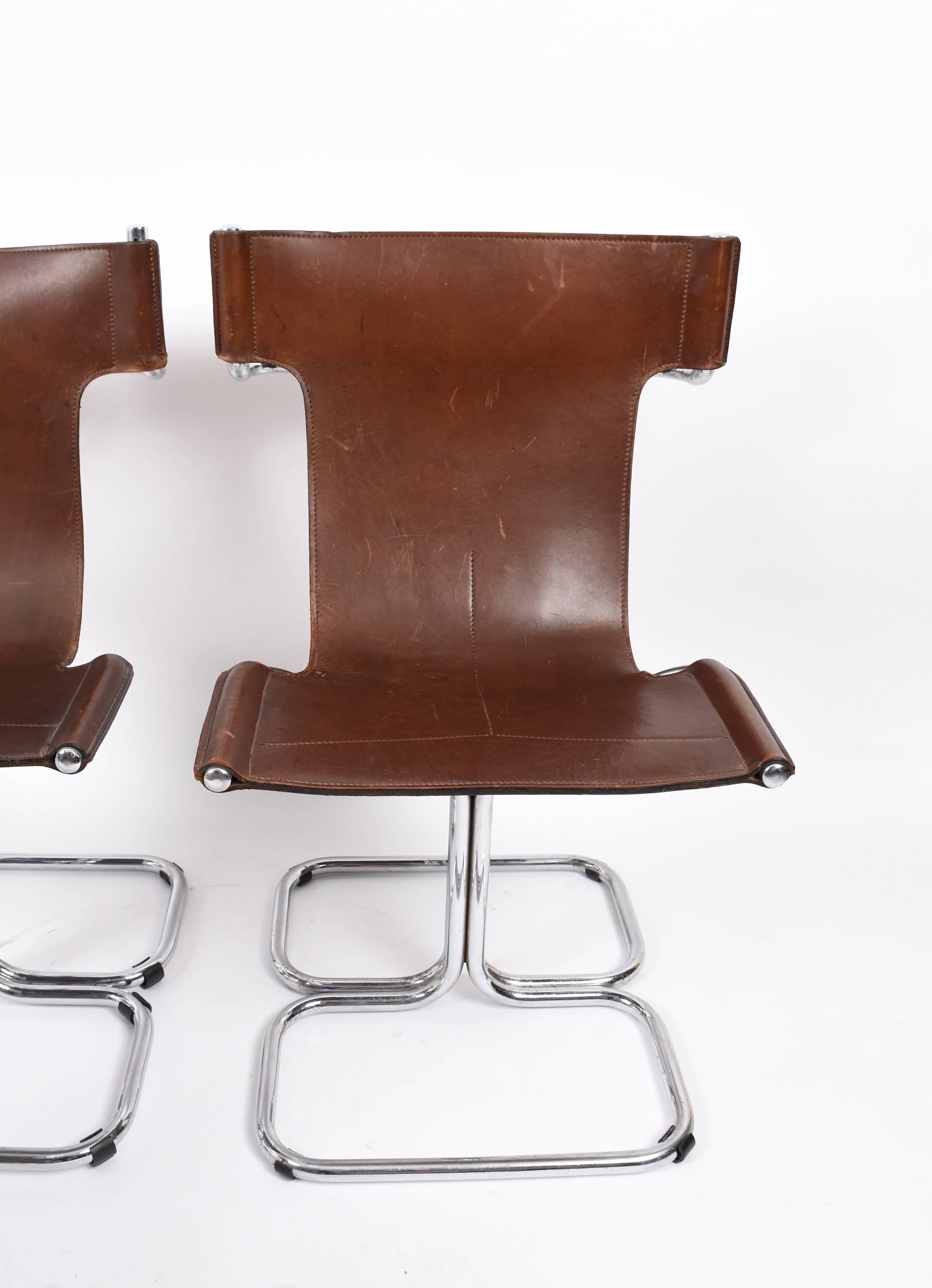 Amazing set of four chairs in original leather condition with tubular steel legs, they were produced in Italy during 1970s by master designer Faleschini.

They are numbered and with initial IF. They have a beautiful leather seam to emphasize its