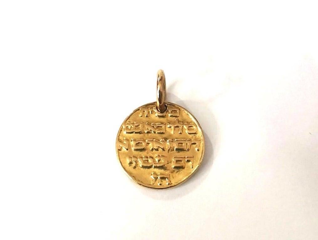A rare Antique yellow gold 18k ''La médaille du Campo del Fiori'' Medallion, by Falize, circa 1897.
Diameter: approximately 0.78 inch.

Of circular outline, depicting the profile of Jesus Christ and Hebrew script in relief, the reverse with Hebrew