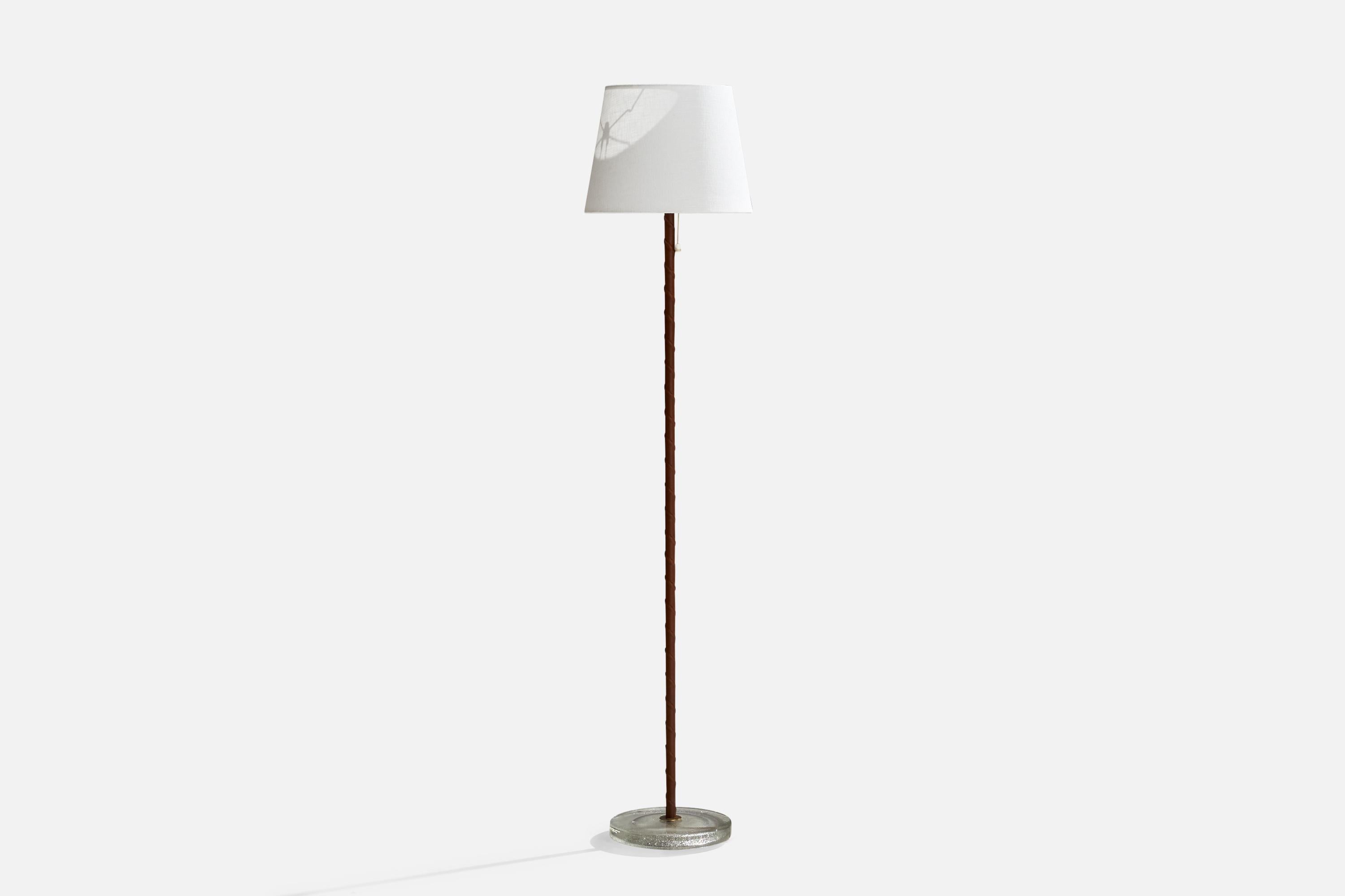 A brass, leather and glass floor lamp designed and produced by Falkenbergs Belysning, Sweden, 1960s.

Overall Dimensions (inches): 50” H x 9.5”  D
Stated dimensions include shade.
Bulb Specifications: E-26 Bulb
Number of Sockets: 1
All lighting will