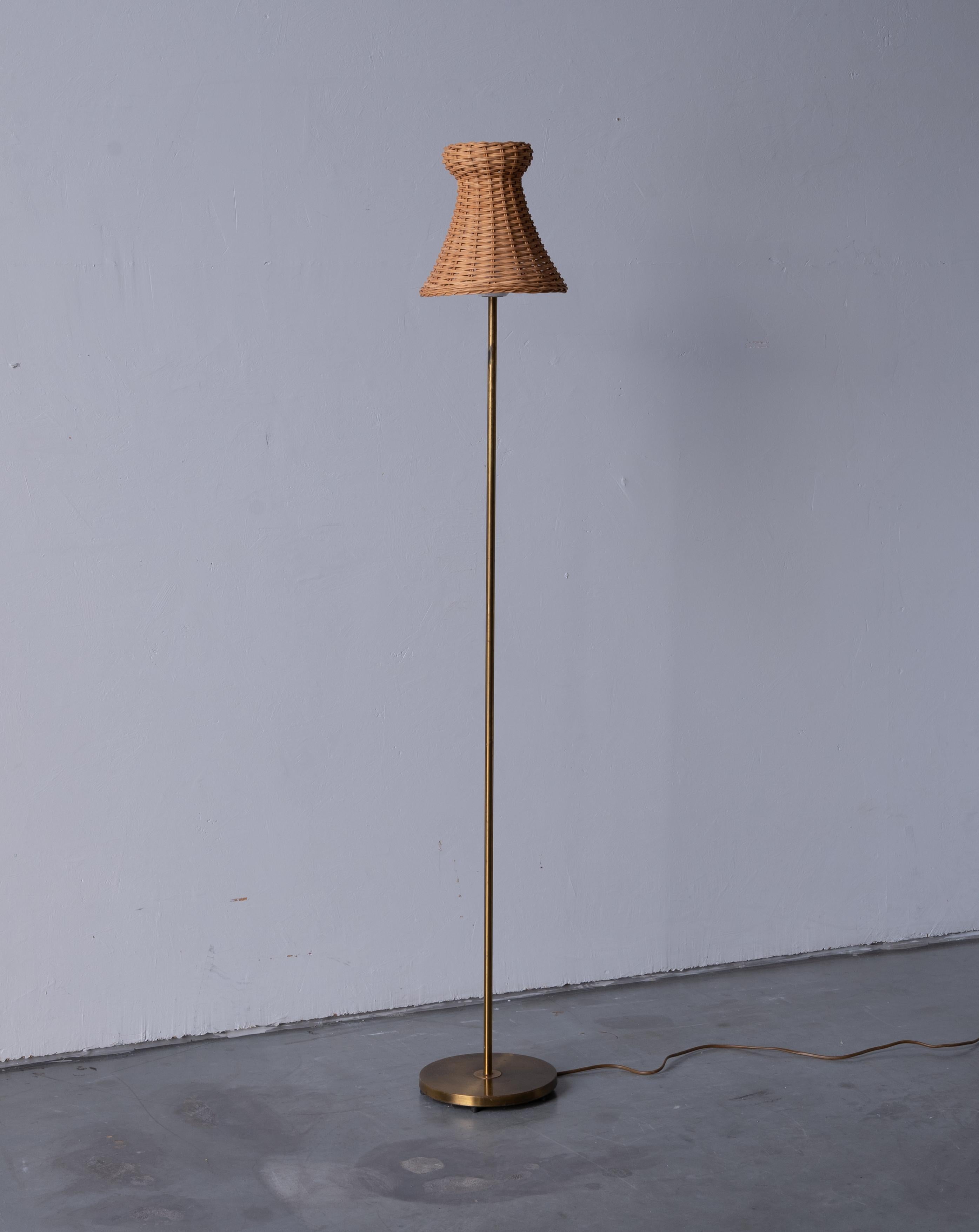 An floor lamp. Produced by Falkenbergs Belysning. Stamped

With an assorted vintage rattan lampshade.

Other designers of the period include Hans Bergström, Hans-Agne Jacobson, Alvar Aalto, Josef Frank, and Paavo Tynell.