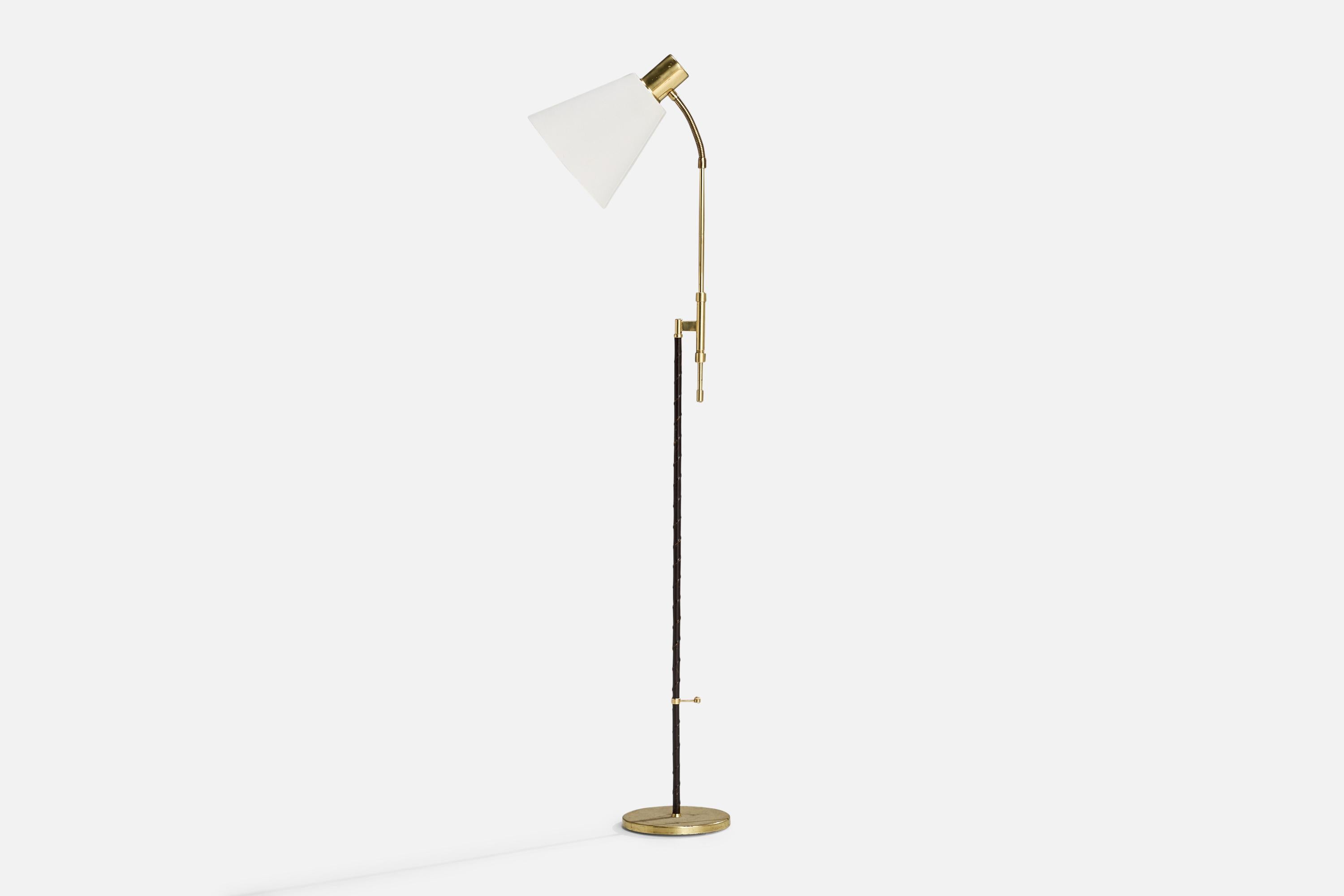 An adjustable brass, leather and fabric floor lamp designed by Falkenbergs Belysning, Sweden, 1950s.

Please note cord feeds visibly from stem connected to socket.

Overall Dimensions (inches): 53.94” H x 8.67”  W x 19.3” D
Stated dimensions include