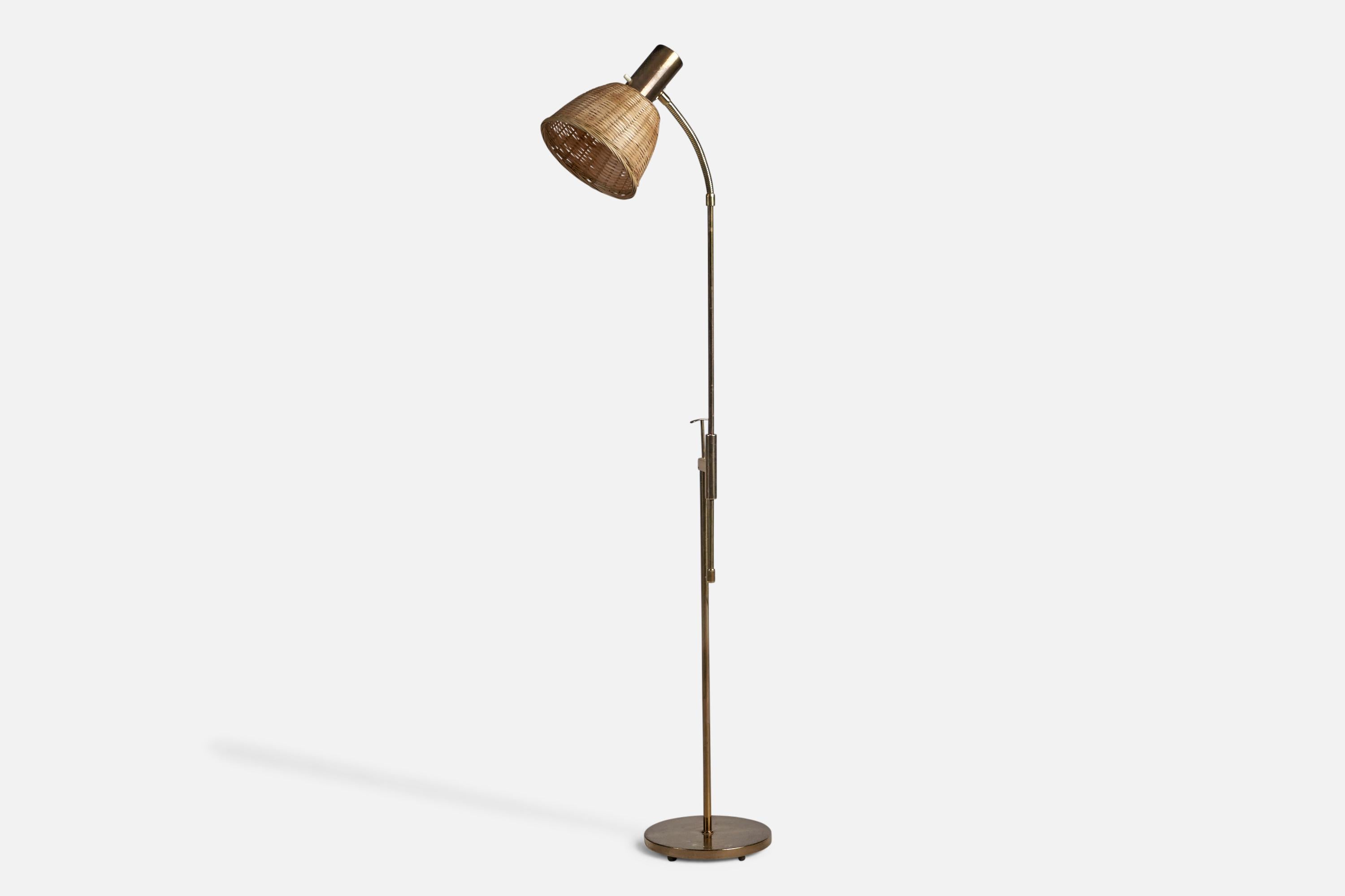 An adjustable brass and rattan floor lamp, designed and produced by Falkenbergs Belysning, Sweden, 1960s.

Overall Dimensions (inches): 49