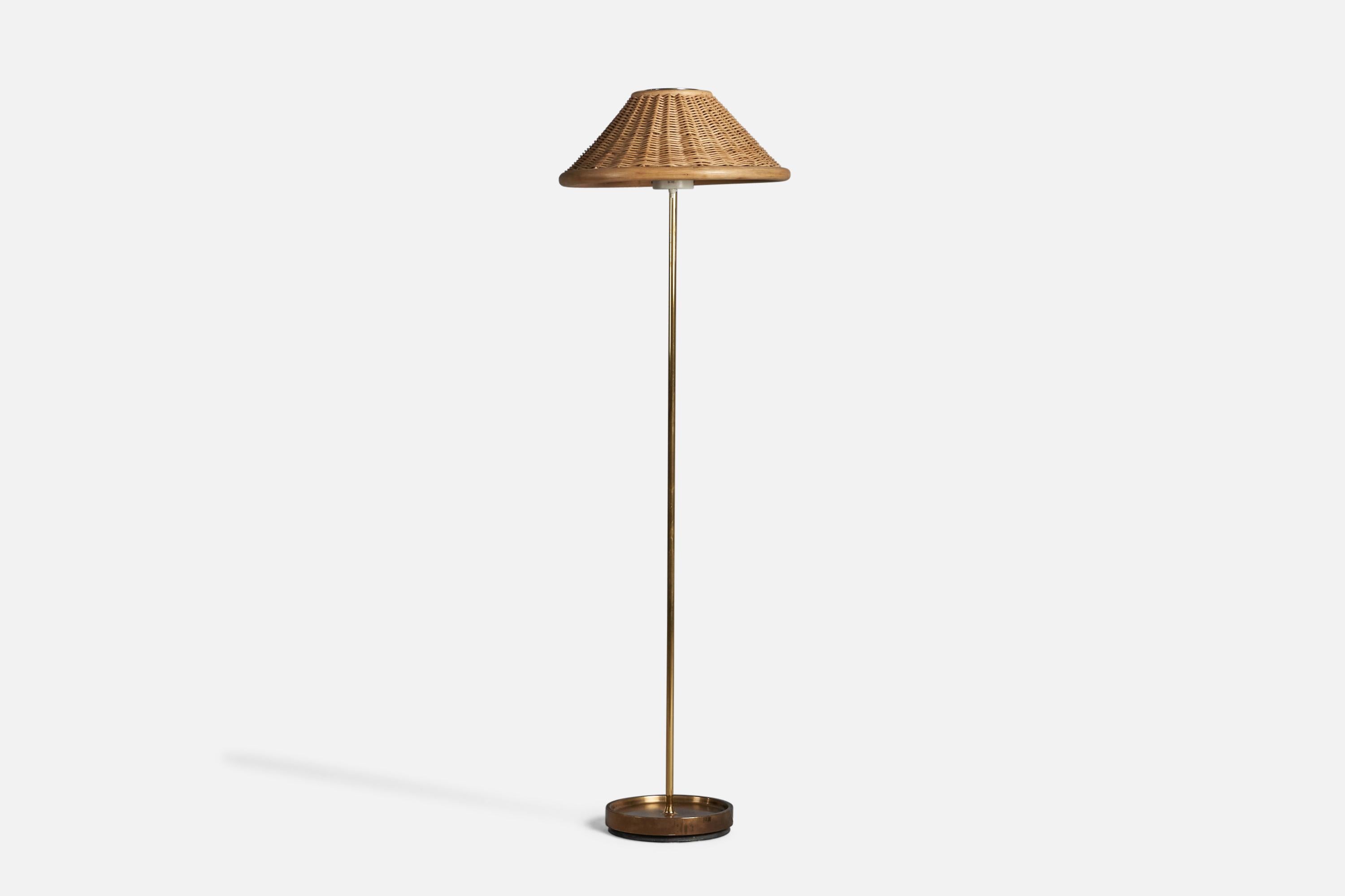 A brass, rattan and bamboo floor lamp designed and produced by Falkenbergs Belysning, Sweden, c. 1960s. 

Overall Dimensions (inches): 58” H x 17.75” Diameter 
Bulb Specifications: E-26 Bulb
Number of Sockets: 1
