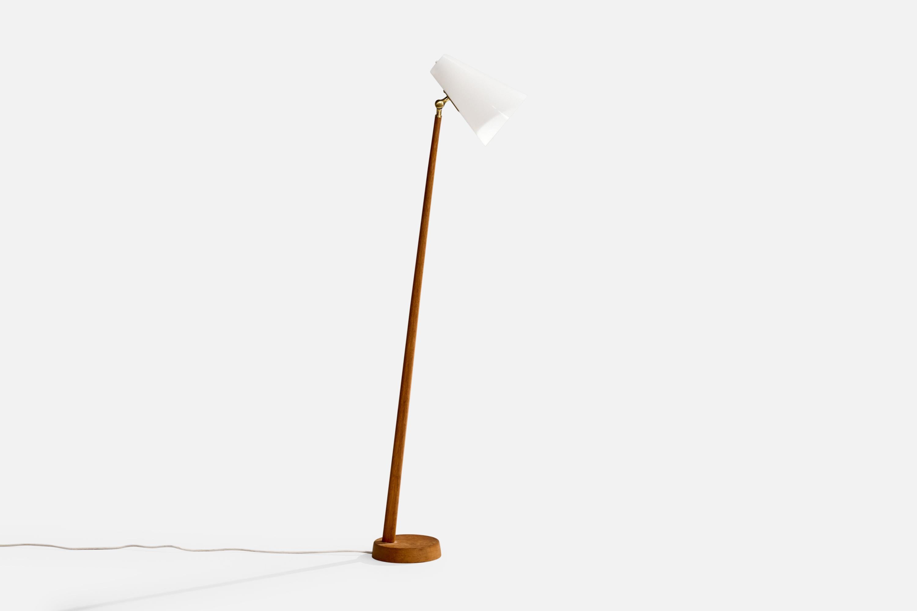 An adjustable oak, brass and white acrylic floor lamp produced by Falkenbergs Belysning, Sweden, c. 1960s.

Dimensions of Lamp (inches): 52.5