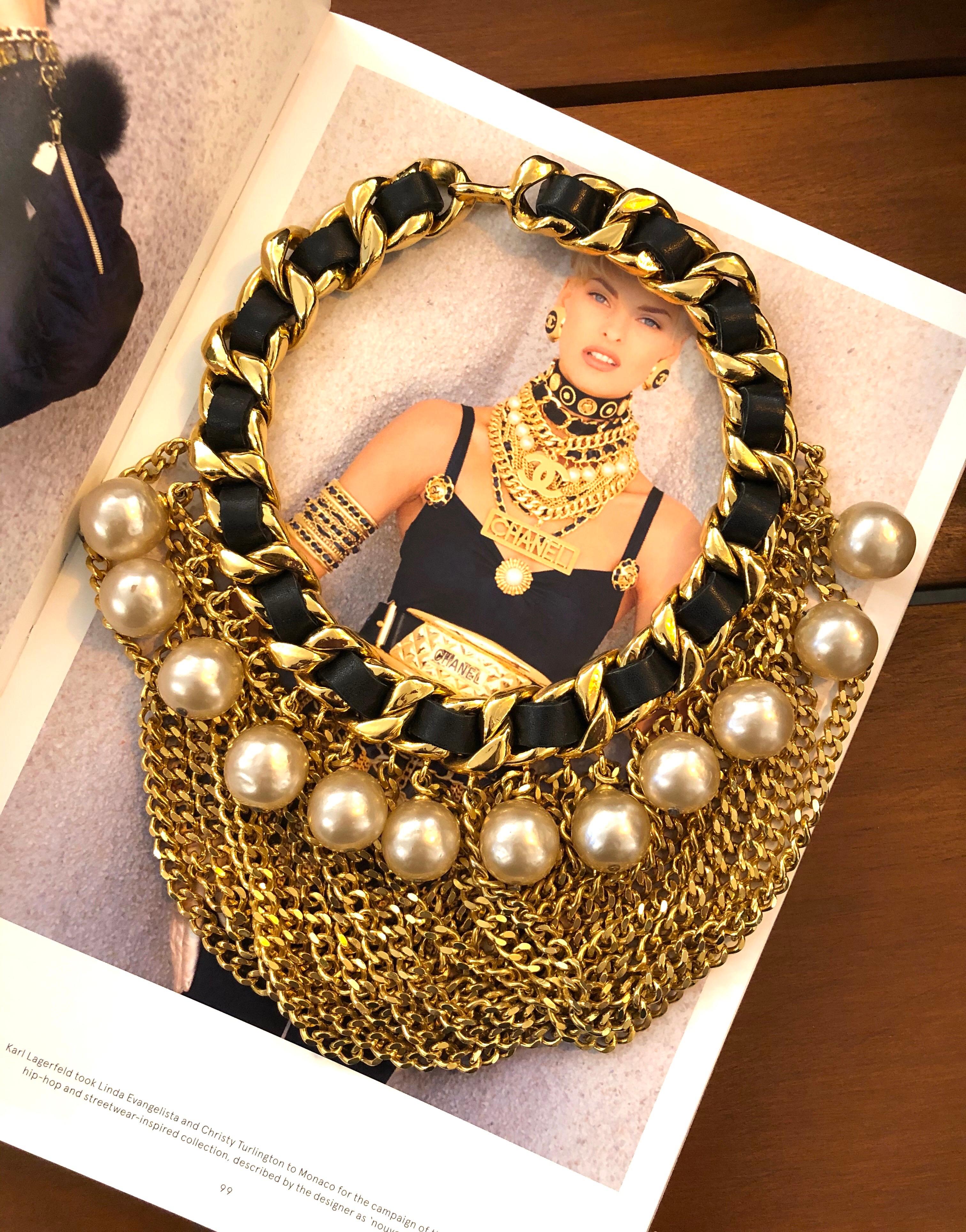 A true statement Chanel necklace featuring oversized faux pearl on a chunky gold toned chain adjourned with layers of gold toned chain. Seen on Chanel runway FW 1991 and a fashion spread on the one and only Linda Evangelista. Stamped Chanel 2 6,