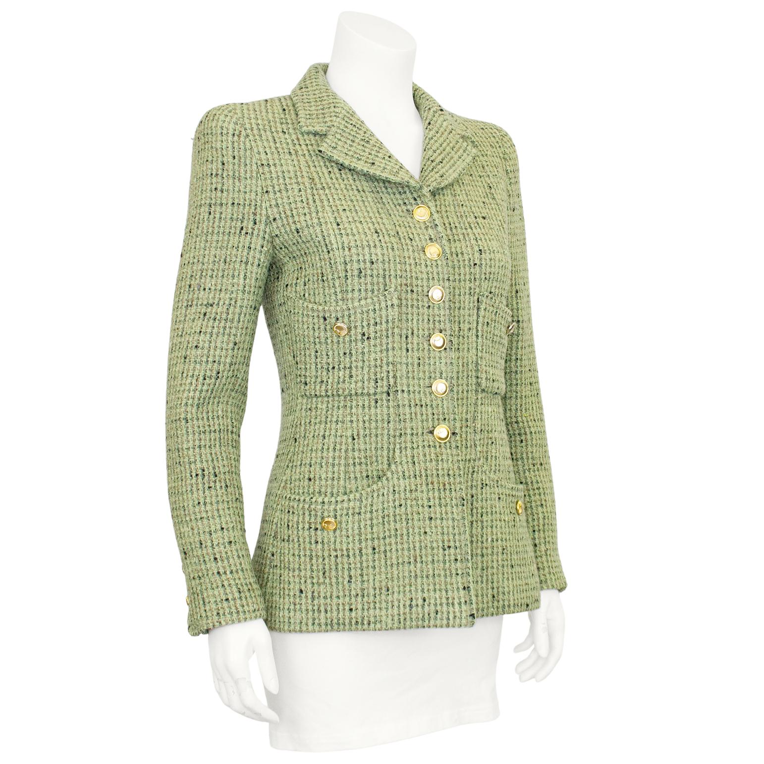 Lovely Chanel 1997 Fall collection mint green bouclé tweed jacket. Features gold ribbed disc style buttons with CC logos down the front and on the front pockets and cuffs. In excellent condition, small shoulder pads to define the shape, fully lined