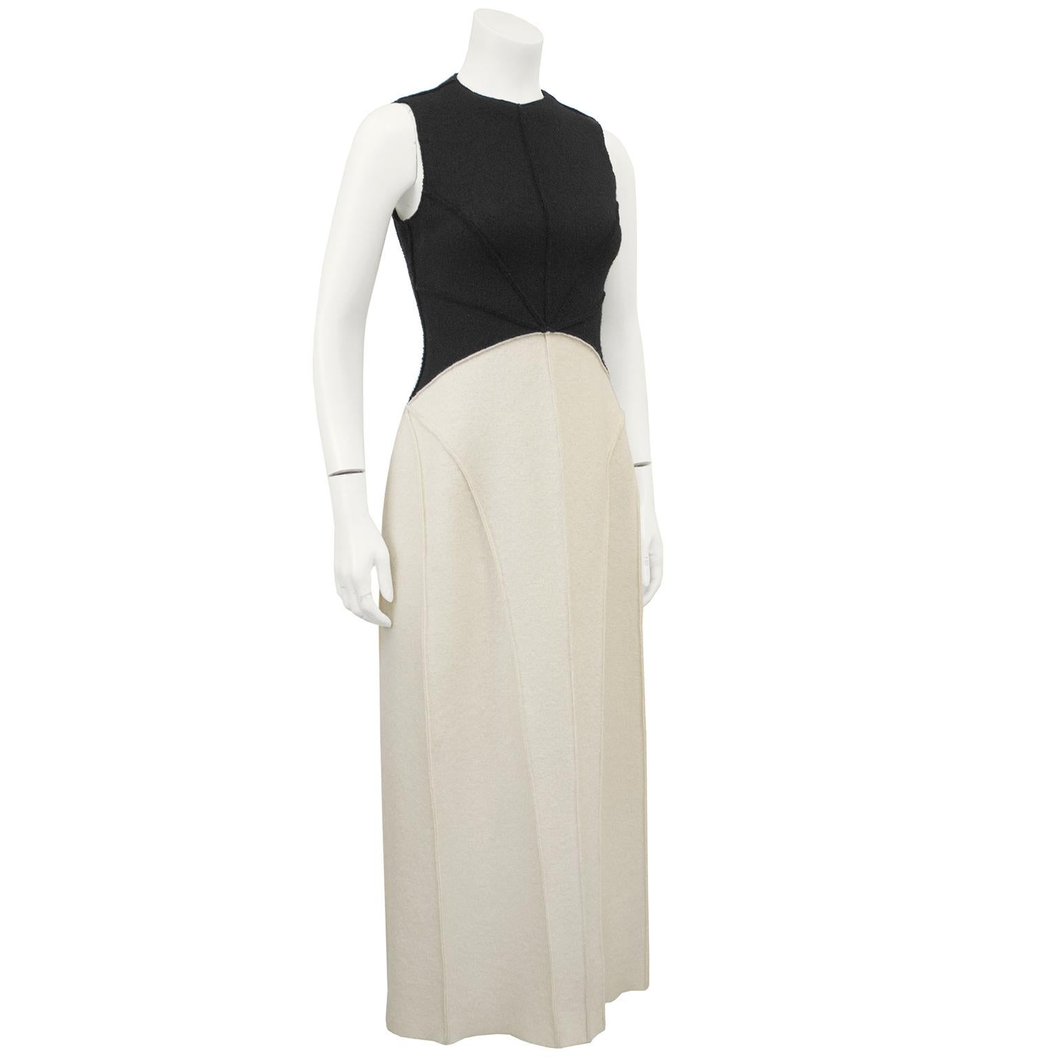 Beautiful Chanel black and cream felted wool maxi dress from Fall 1999 collection. The bottom of the dress is cream while the top is black with a curved seam accentuating the waist, higher in the front and lower in the back. Seams down the front and