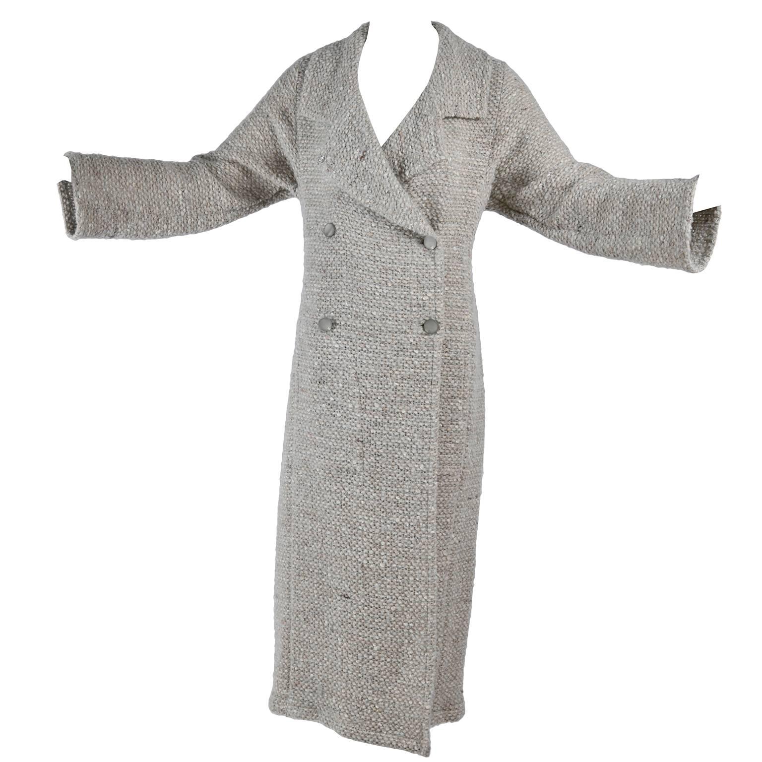 This lovely vintage Autumn 1999 Chanel Lesage fantasy tweed coat is in a Wool - Mohair blend and is labeled a French size 36. The coat is a beautiful cream, brown,ivory and soft blue and is comprised of 34% wool, 29% rayon, 19% mohair, 17% acrylic