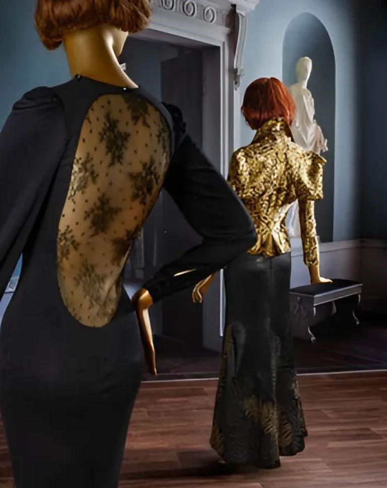 BLACK SILK JERSEY DRESS FROM ALEXANDER MCQUEEN 2005 WITH A LOW LACE BACK

This is a stunning evening dress made of black stretch jersey with sheer lace on the back. This gorgeous, iconic dress was filmed at the screening of McQueen's The Man Who