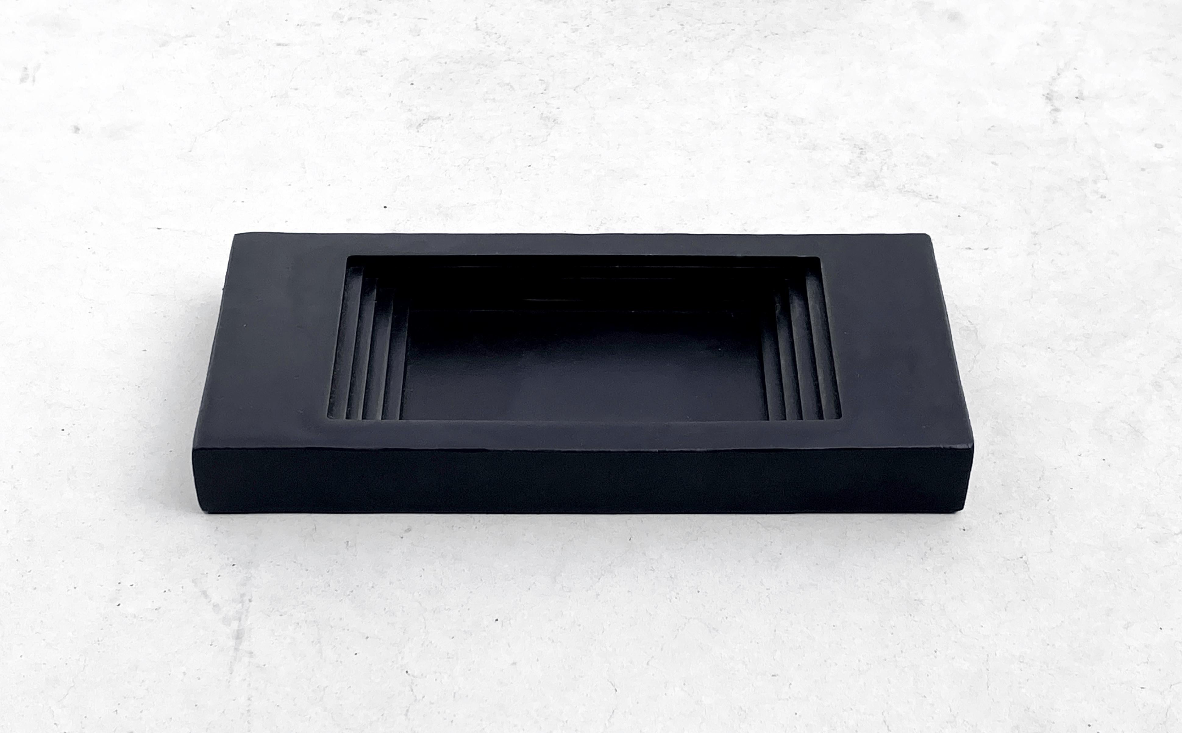 Fall Blackened Ashtray by Cal Summers
Dimension:  D 6.9  x W 15.2 x H 2 cm 
Materials: Stainless Steel 

Cal Summers is a British designer who makes bespoke handmade furniture and contemporary artefacts in which he challenges the boundaries of
