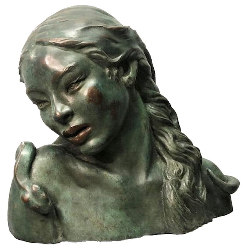 Bearing a clear aesthetic influence of the Art Deco era, this wonderfully beautiful image of the progenitor Eve is a Western-European school sculptural portrait of a stunningly beautiful young woman in the state of erotic ecstasy; bowing her head