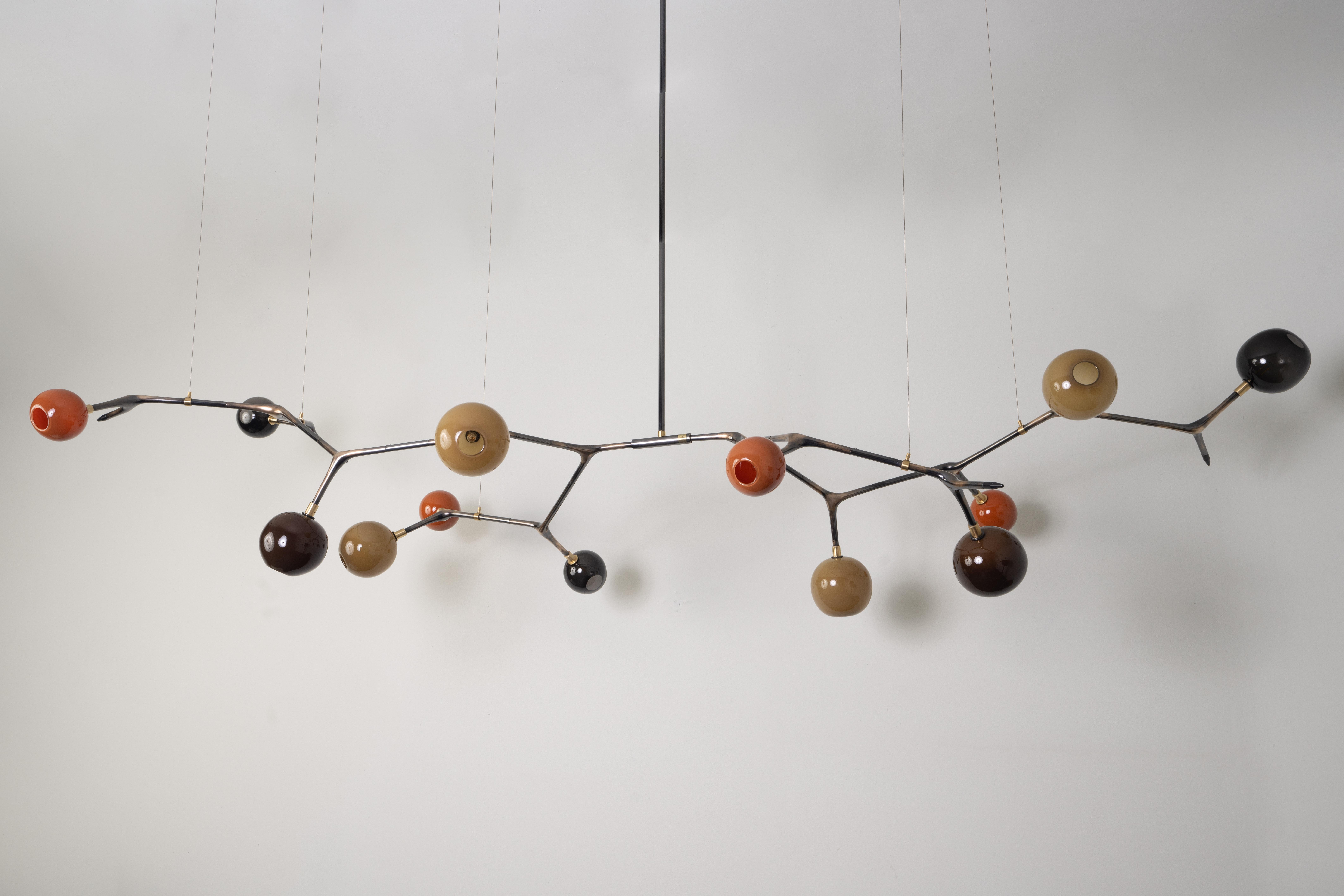 Fall Vintage Bronze Mantis 13 Pendant Lamp by Isabel Moncada
Dimensions: Ø 280 x H 145 cm.
Materials: Cast bronze with vintage finish, blown glass and turned brass.
Weight: 17 kg.

Just like the insect it shares its name with, this piece is
