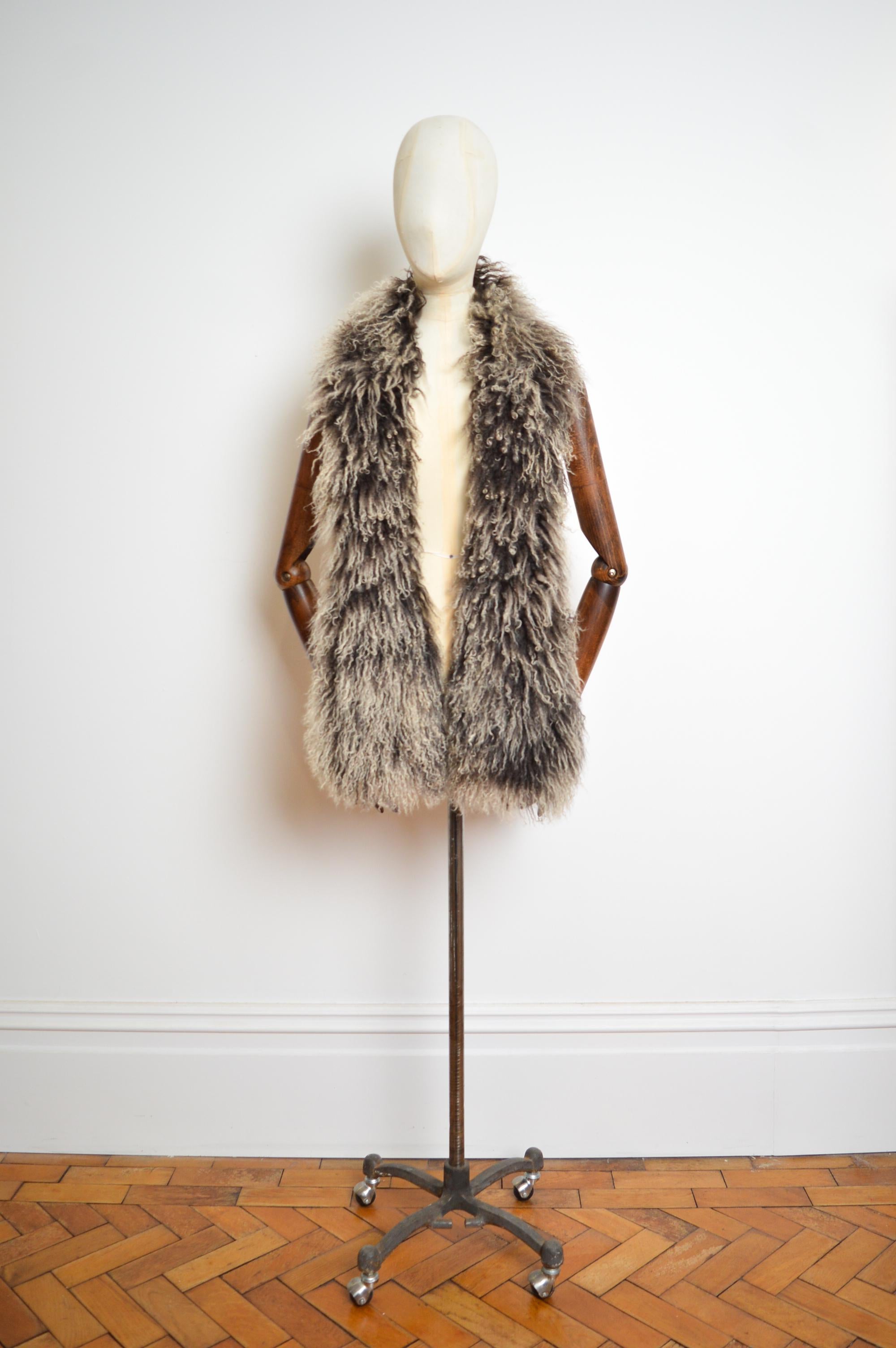 Fall / Winter 2000 Christian Dior by John Galliano.

A beautiful Chocolate brown natural mongolian lamb, shearling boa fully lined with  the complementing and highly iconic 'DIOR' Trotter monogram in pure silk.

This Garment can be styled in a