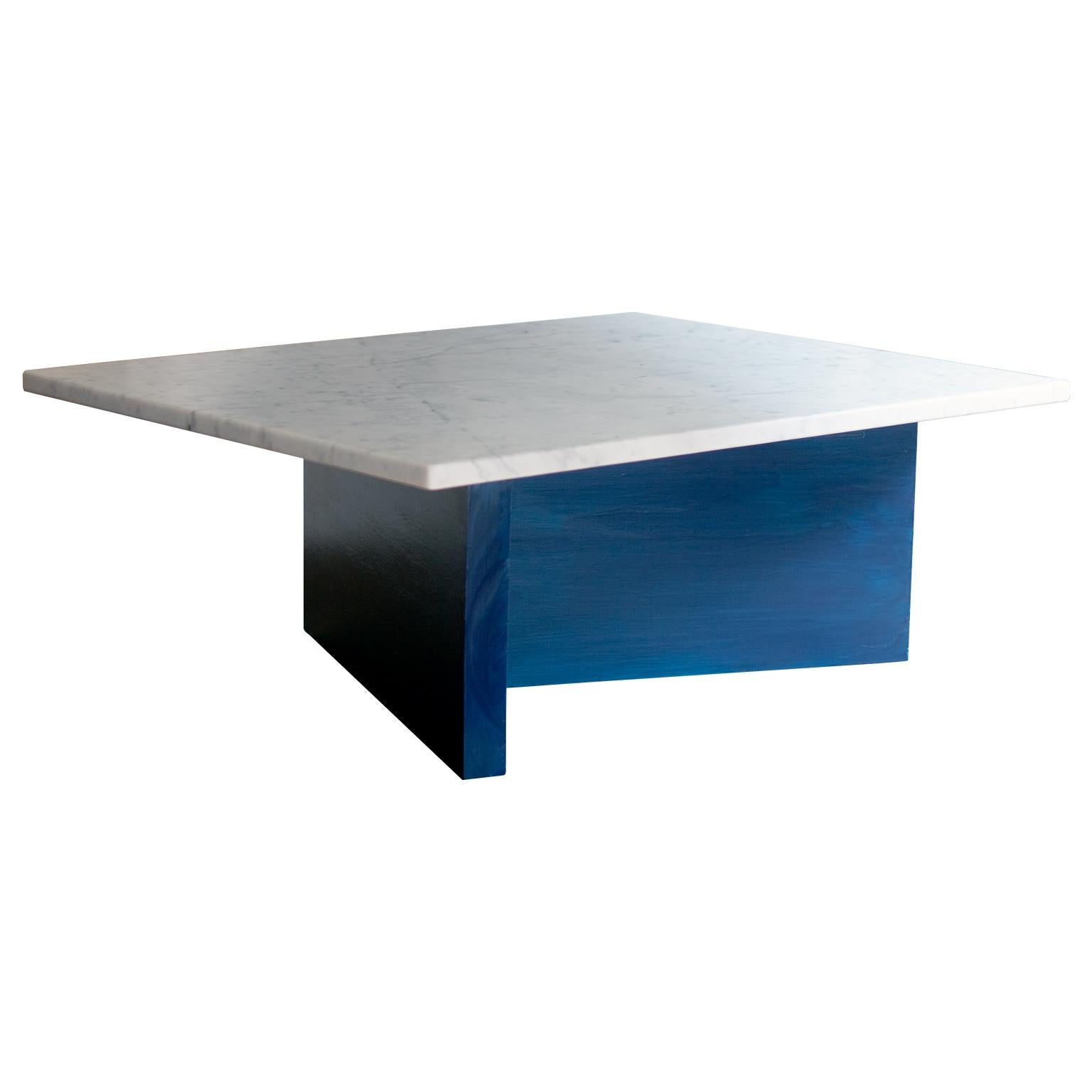A beautiful, minimal coffee table inspired by Bauhaus architecture and art. 
This piece features a honed Carrara marble top on a solid maple wood base finished in lacquer. 

Customizable marble and lacquer finishes are available. 
Customizable