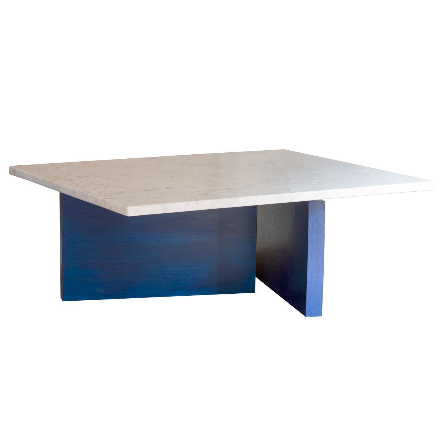 A beautiful, minimal coffee table inspired by Bauhaus architecture and art. 
This piece features a honed Carrara marble top on a solid maple wood base finished in lacquer. 

Customizable marble and lacquer finishes are available. 
Customizable