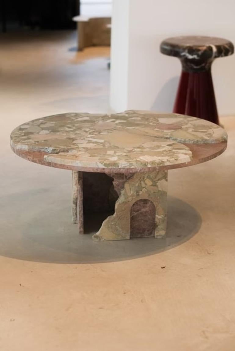 The Fallen Empire collection consists of four striking pieces— a round coffee table, a side table, a console, and a dining table—each meticulously crafted from a selection of the finest marbles. These include Verde Alpi, Rosa Peralba, Travertine