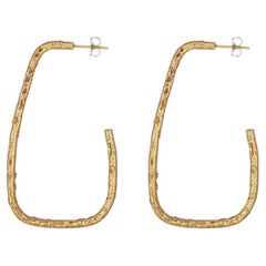 False Circle Earrings are handcrafted of 24ct gold-plated bronze and the ear pin