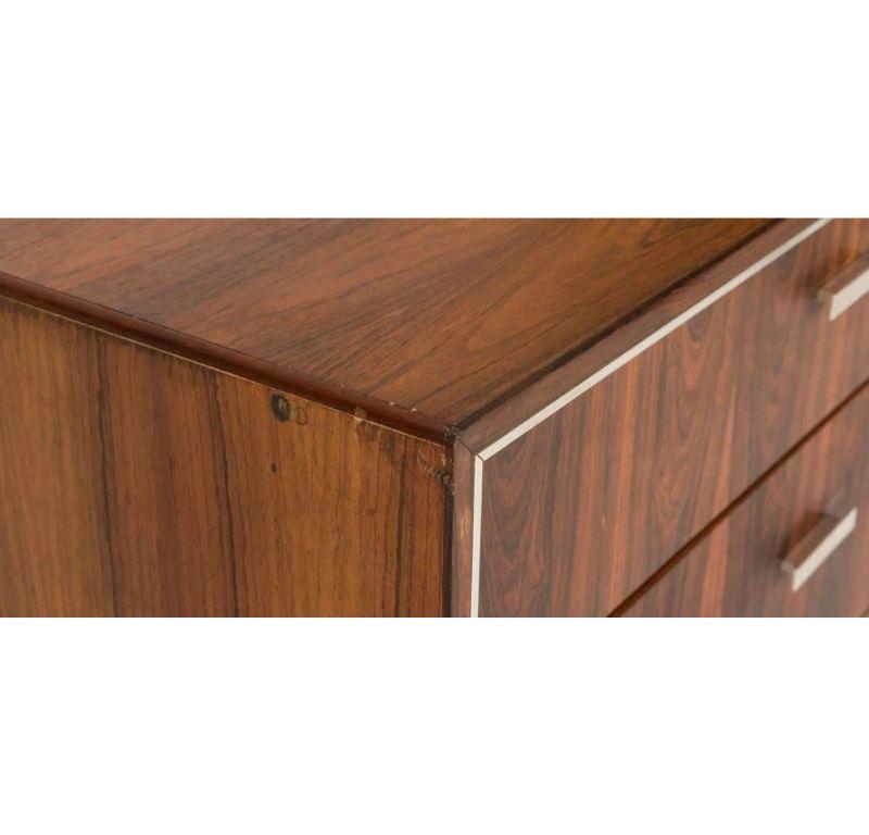 Listed for sale is a delightful credenza / large dresser by Falster of Denmark, made from Brazilian Rosewood. The pieces were purchased from Maurice Villency, a high end furniture store that was known for importing high quality danish pieces. They
