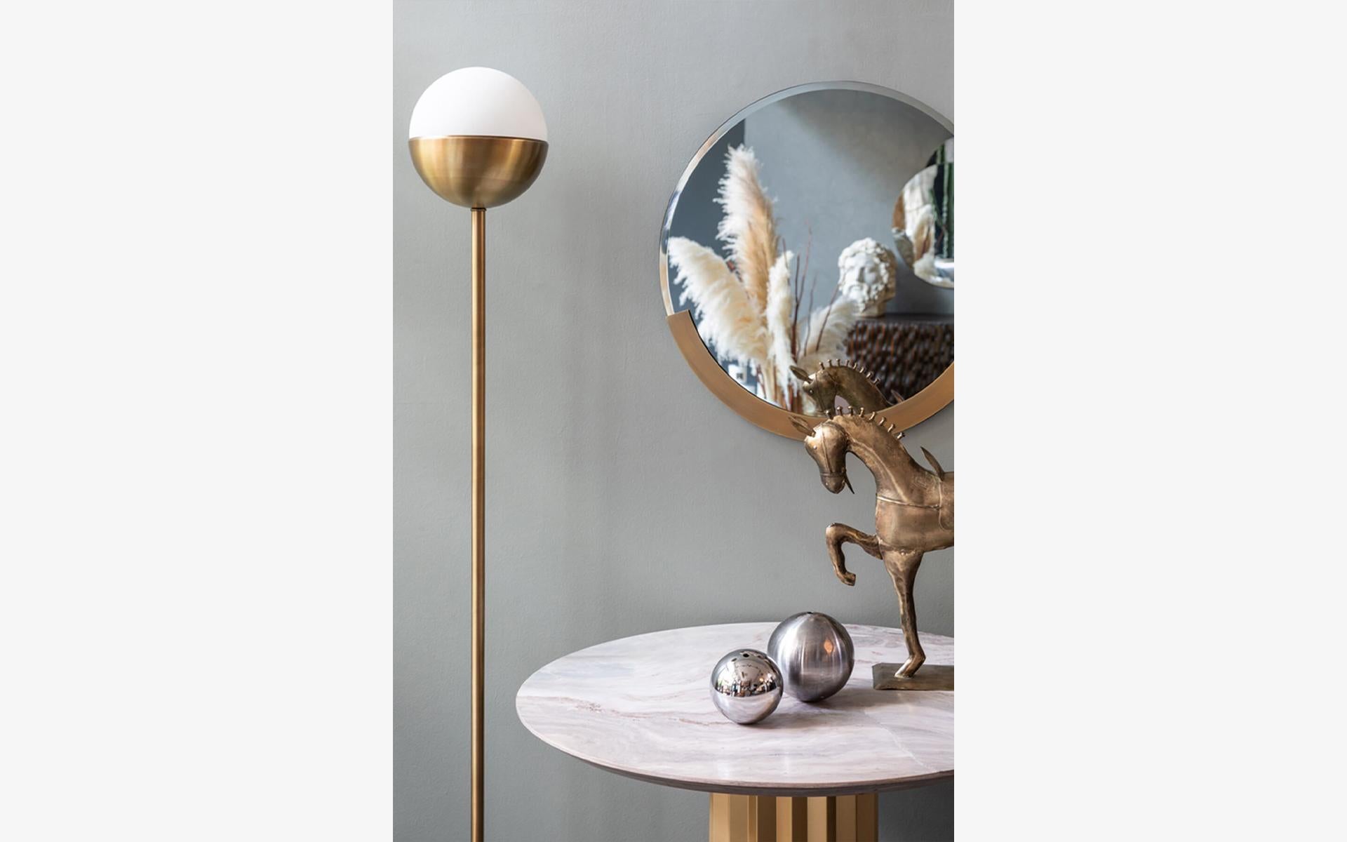 While the organic form of the marble and brass combination carries the symbol of the universe to the spaces, Famed Floor Lamp provides peace with its calm light.

While the round form of the marble and brass combination carries the symbol of the